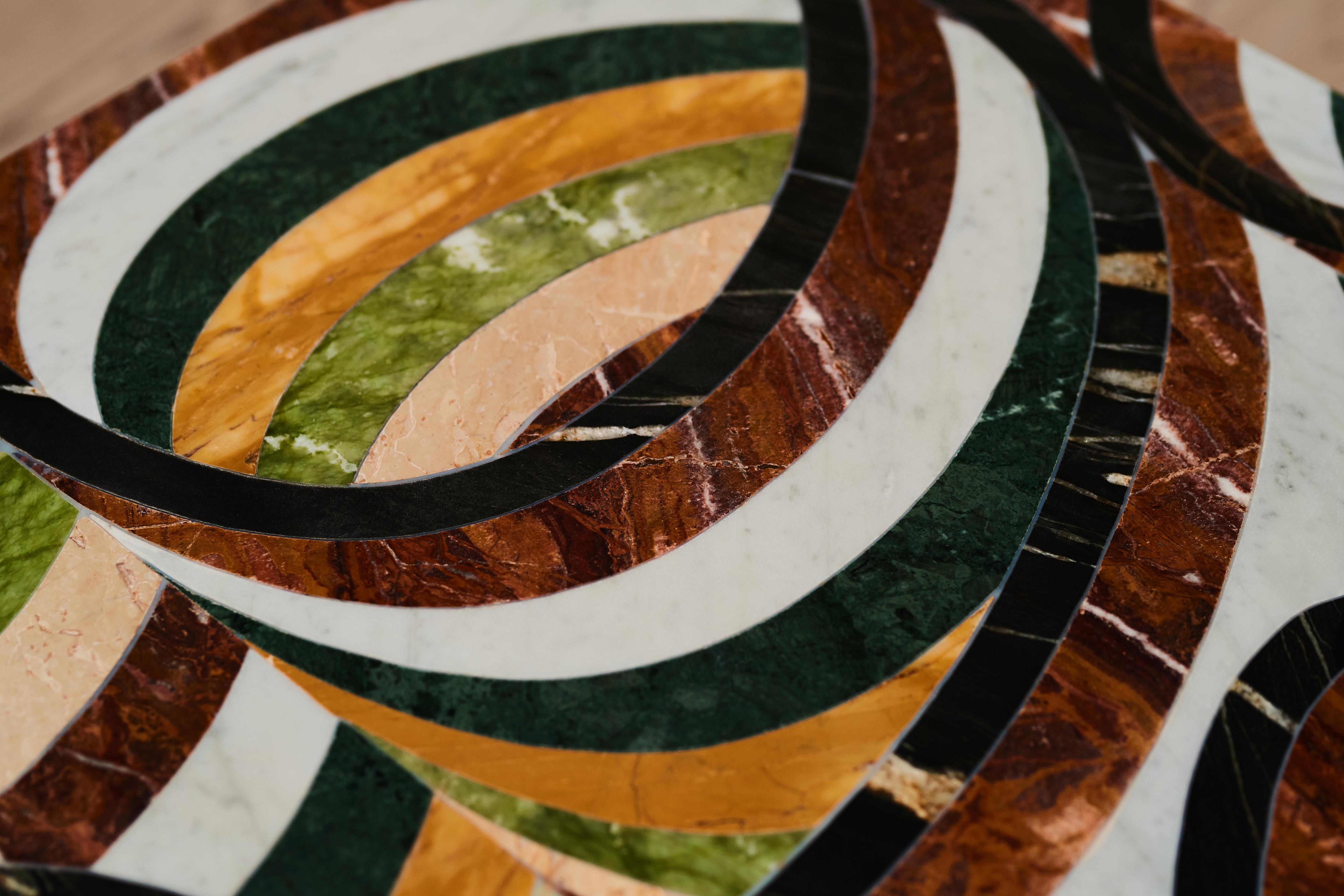 One of a kind table created by artist Rhys Coren in collaboration with artisanal marble expert Peter Noyce. 

A collage of Imperial Black granite, Red Jasper marble, Giallo Siena marble, Carrara marble, Ming Green marble, Emerald Green marble and