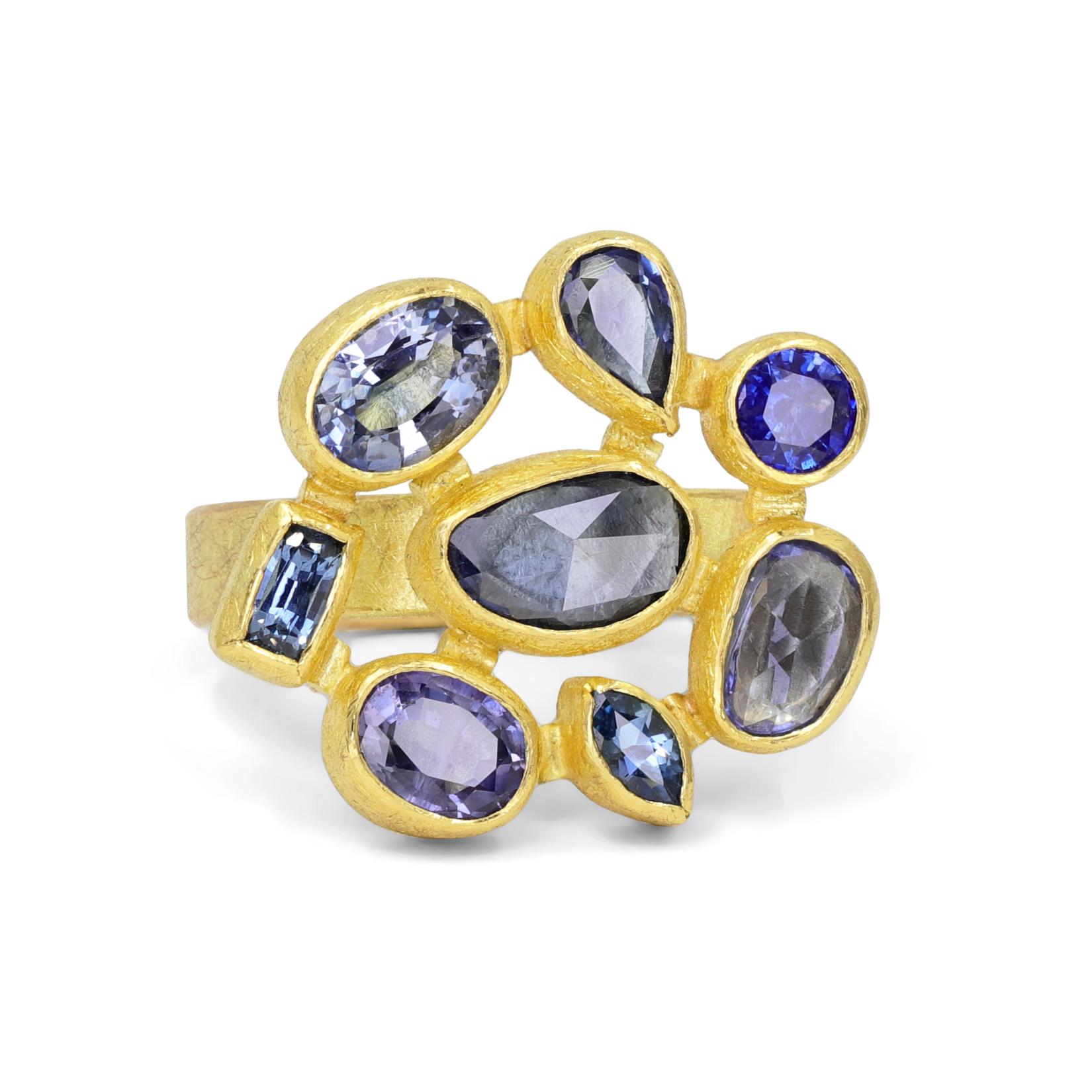 One of a Kind Mosaic Ring handmade by award-winning jewelry artist Petra Class showcasing a gorgeous mix of brilliant-cut and rose-cut blue and violet sapphires in assorted shapes, individually bezel-set in the maker's signature finely-textured 22k