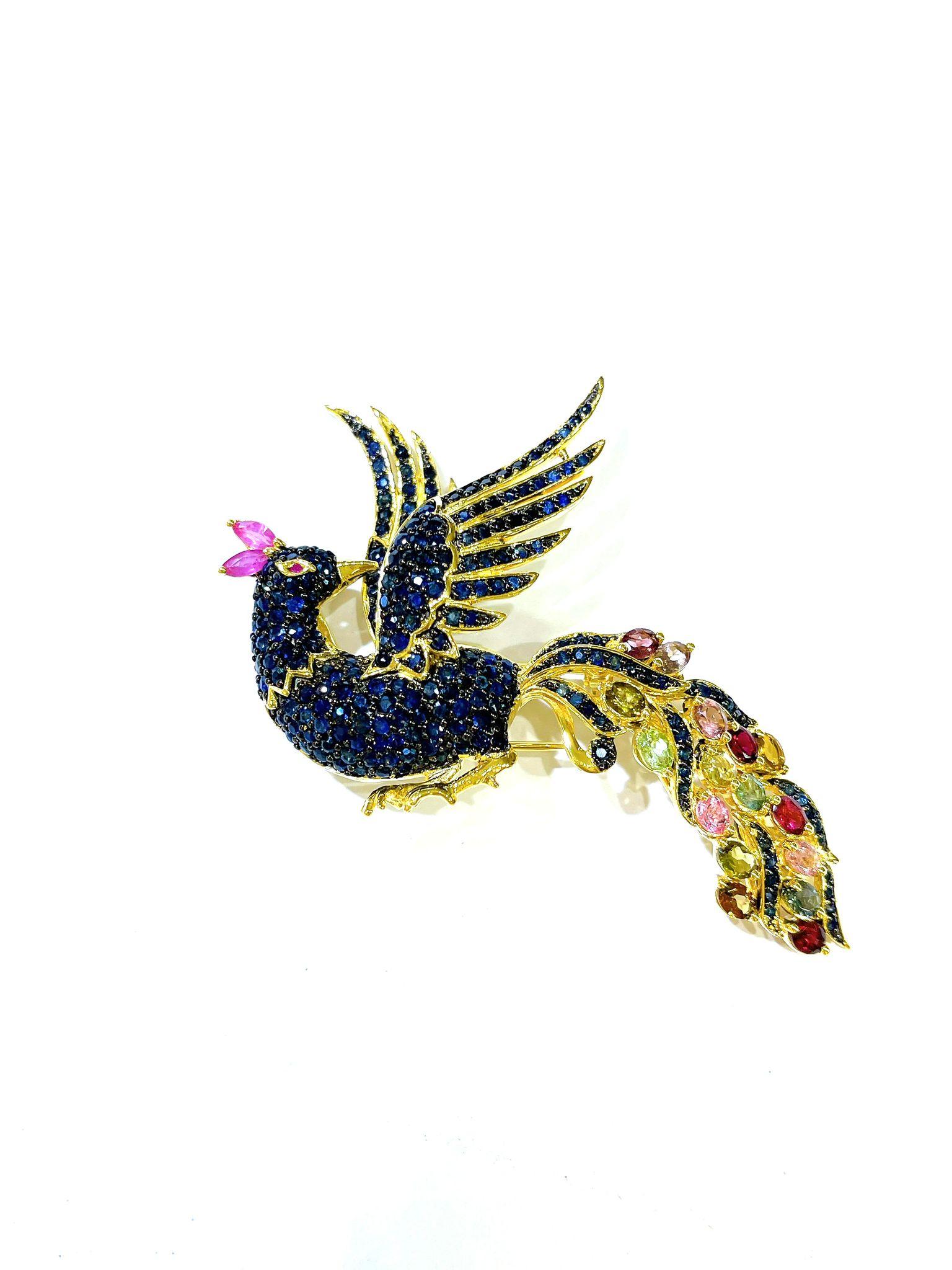 One of a kind Bochic “Orient” Peacock  Ruby, Multi Sapphires & Tsavorite Brooch Set 18K Gold & Silver 

Can be worn as a brooch and a pendant 

Natural Red Ruby  - 2 carat 
Multi color Natural Sapphires from Sri Lanka 
16 carat
Green Tsavorite - 2