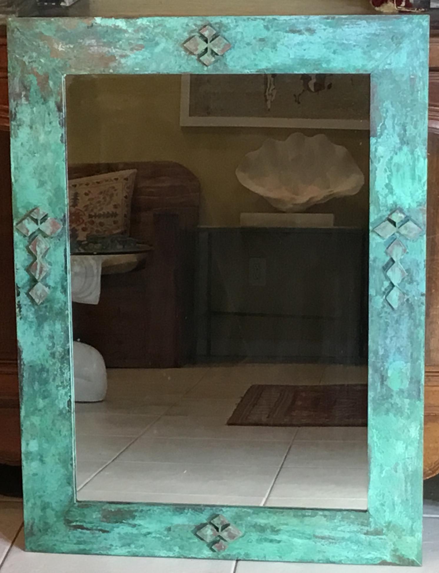 Beautiful architectural mirror made of bronze with geometric motifs imbedded in, oxidation of green and turquoise colors enhance the exceptional beauty, use indoor or outdoor.
 