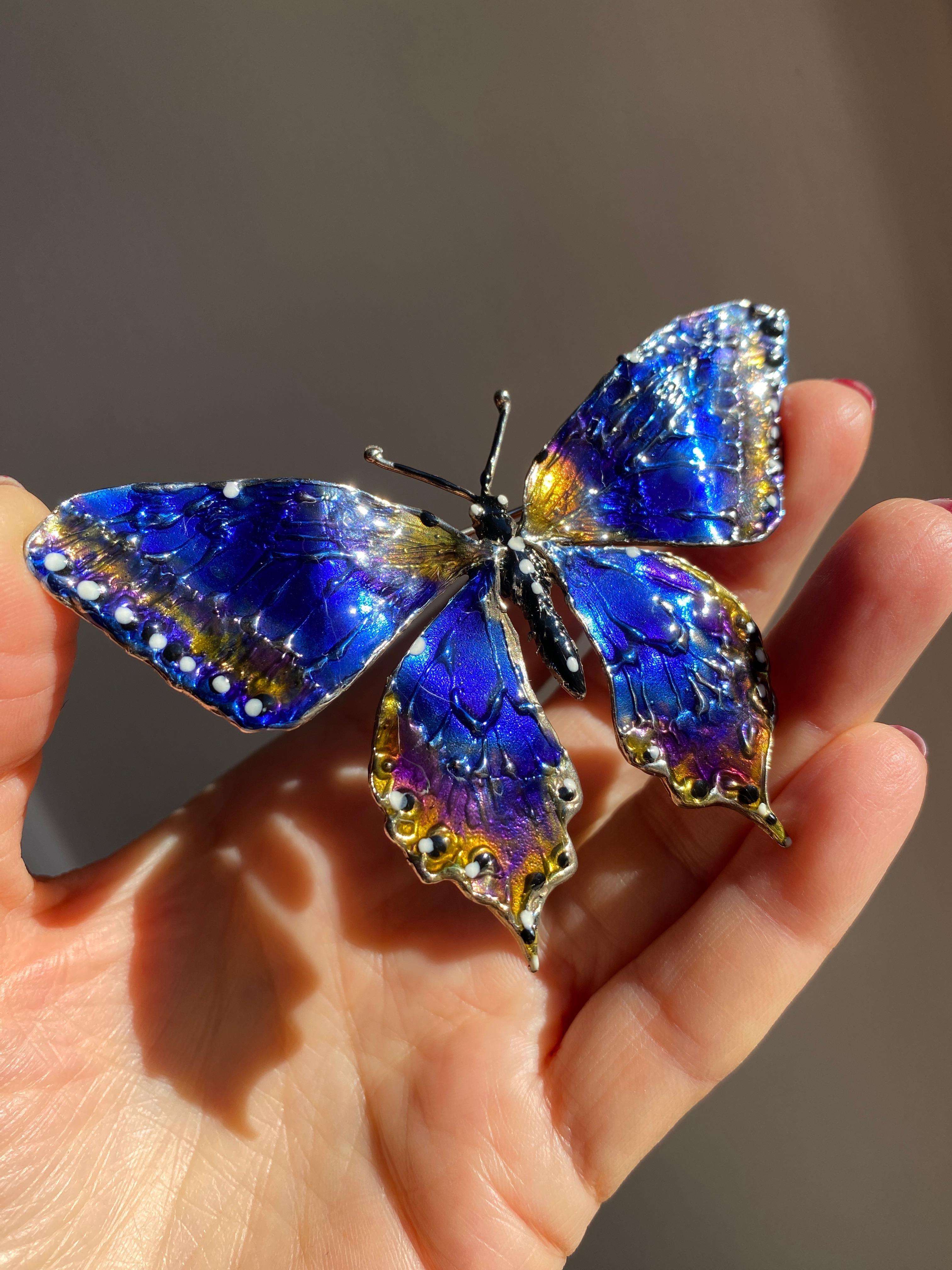 Rossella Ugolini one -of-a-kind butterfly Hand Painted Blue and Yellow Wings Enamel Brooch. The butterfly is handcrafted in Sterling Silver, the body is burnished and the wings are hand painted with vitrified enamel in the shades of blue and yellow.