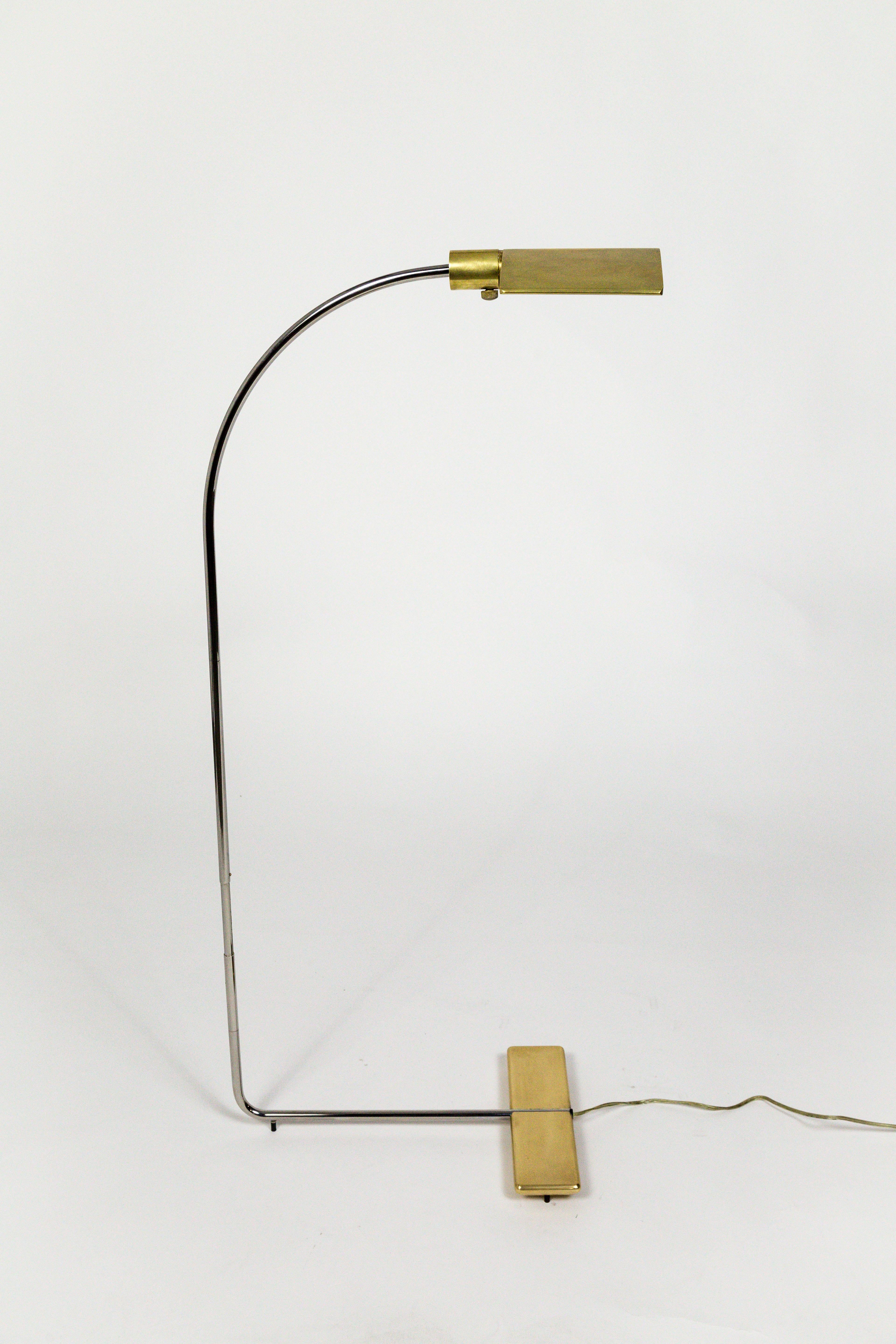 This Cedric Hartman chrome and brass floor lamp is an early version of a lamp which later became known as the 91CO lamp. This is a one of a kind, custom version where Cedric Hartman increased the length of the base as well as the arch, to