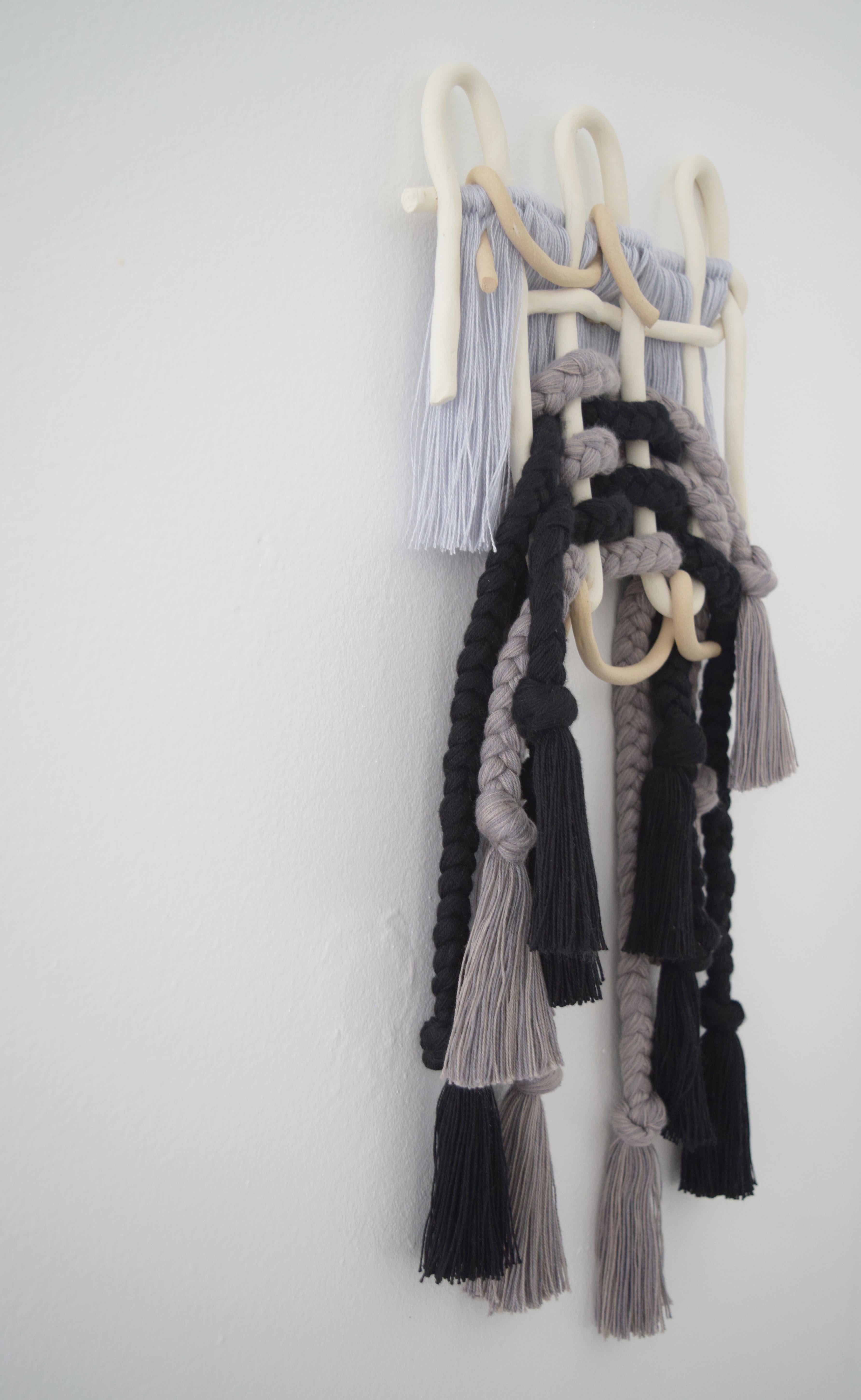 One of a kind wall sculpture #628 By Karen Gayle Tinney

One of a Kind wall sculpture in mixed materials of ceramic and braided cotton/tencel fibers. A woven ceramic panel is intertwined with braids of cotton and tencel in black and tonal grays.