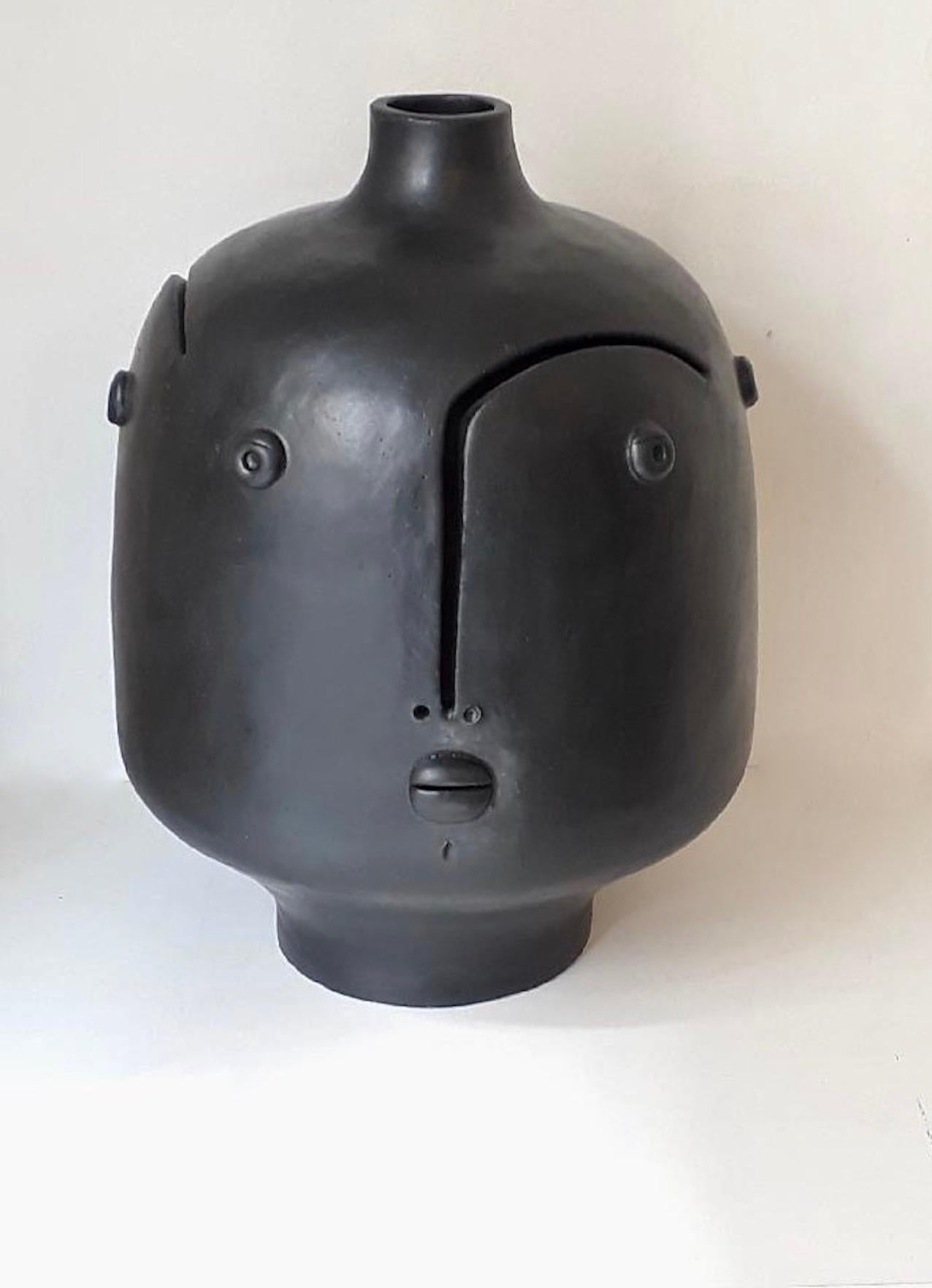 Hand-sculpted ceramic lamp base or sculpture with 3 faces 
One of a kind stoneware piece glazed in satined black enamel signed by the French ceramicists Dalo 
The height dimension is for the ceramic sculpture solely 

Note to international