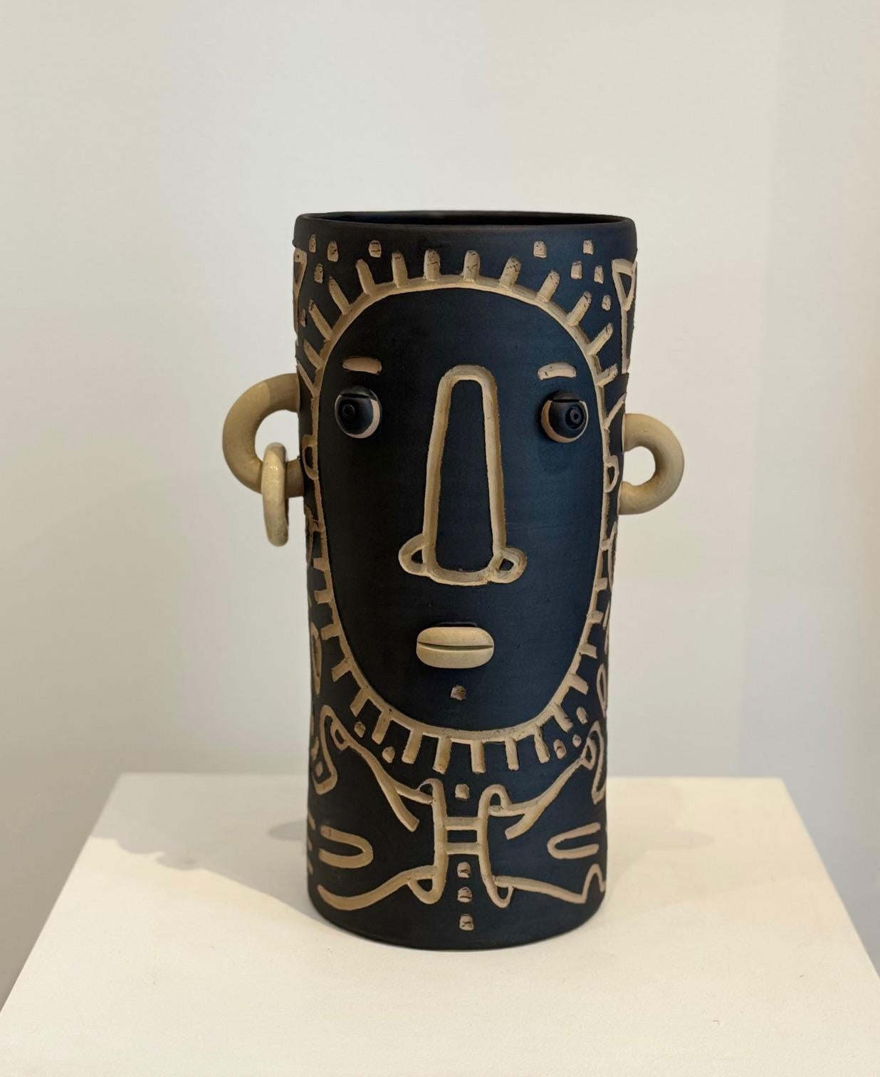 Hand-sculpted ceramic Sculpture or decorative vase with stylized face 
One of a kind handmade piece signed by the French ceramicists DALO, this piece is engraved by the french artist Semilu 
Collaboration 2025 DALO & SEMILU
The height is 35 cm

