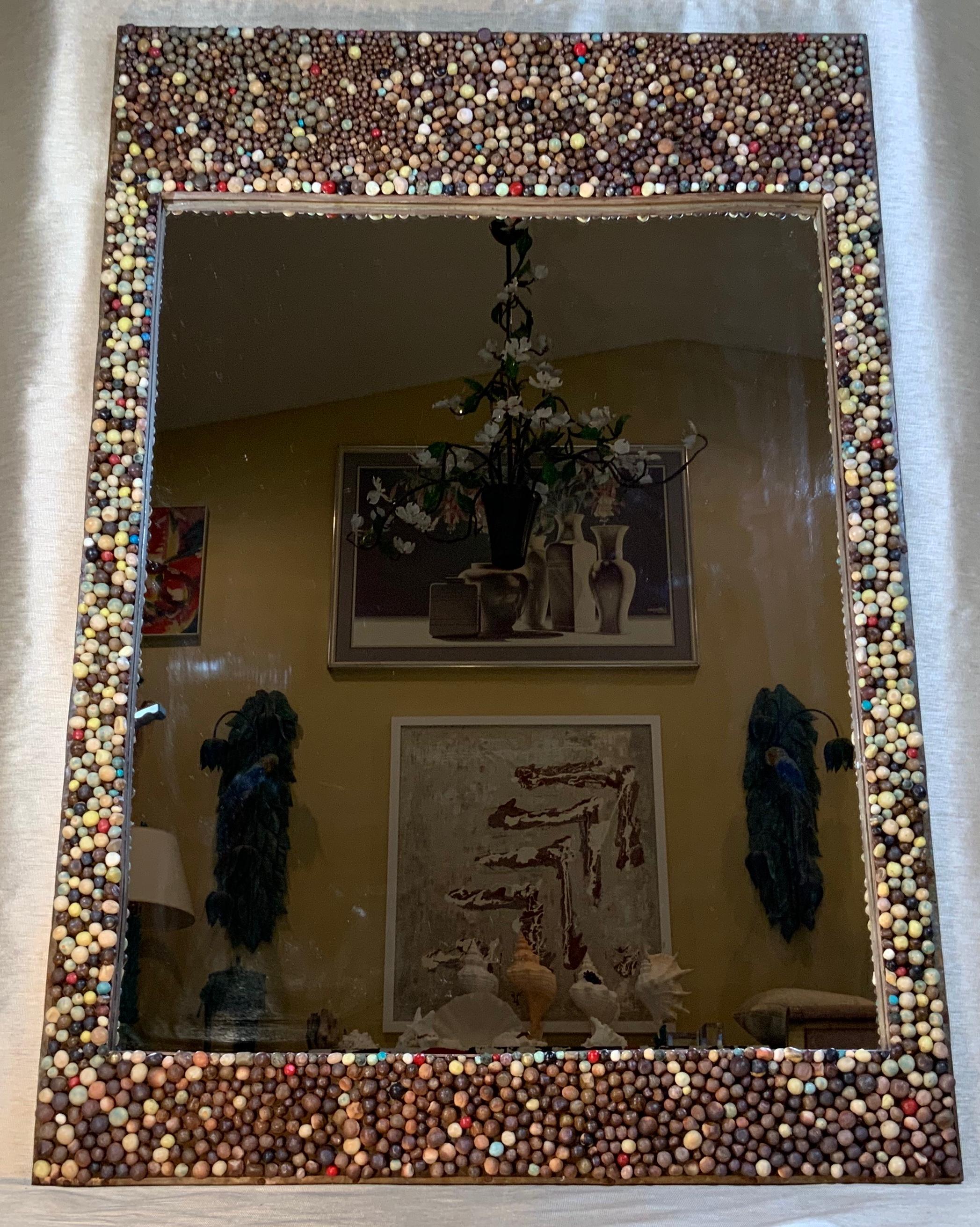 Funky wall mirror artistically made of wood frame cover with copper mash and hundreds of individually handmade and painted ceramic balls imbedded on the copper mash, that’s included some small brass elements in round shape. All together to make