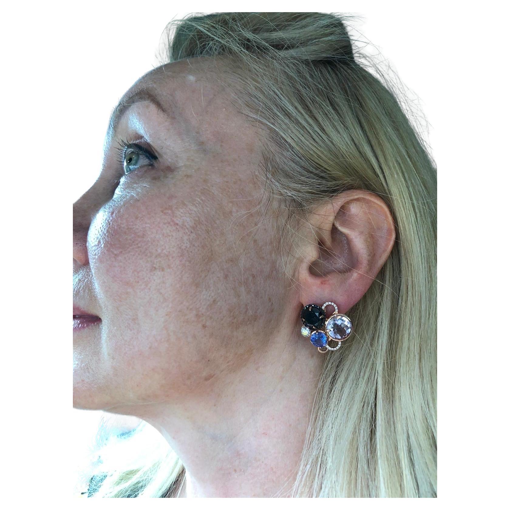Stunning one of a kind earrings featuring black diamonds, white diamonds, morganite gemstones and tanzanite. Such a lovely combination with omega backing for security. The earrings are made with all natural diamond and gemstones totaling 8 carats