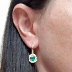 One-of-a-kind Colombian emerald and diamond halo drop earrings