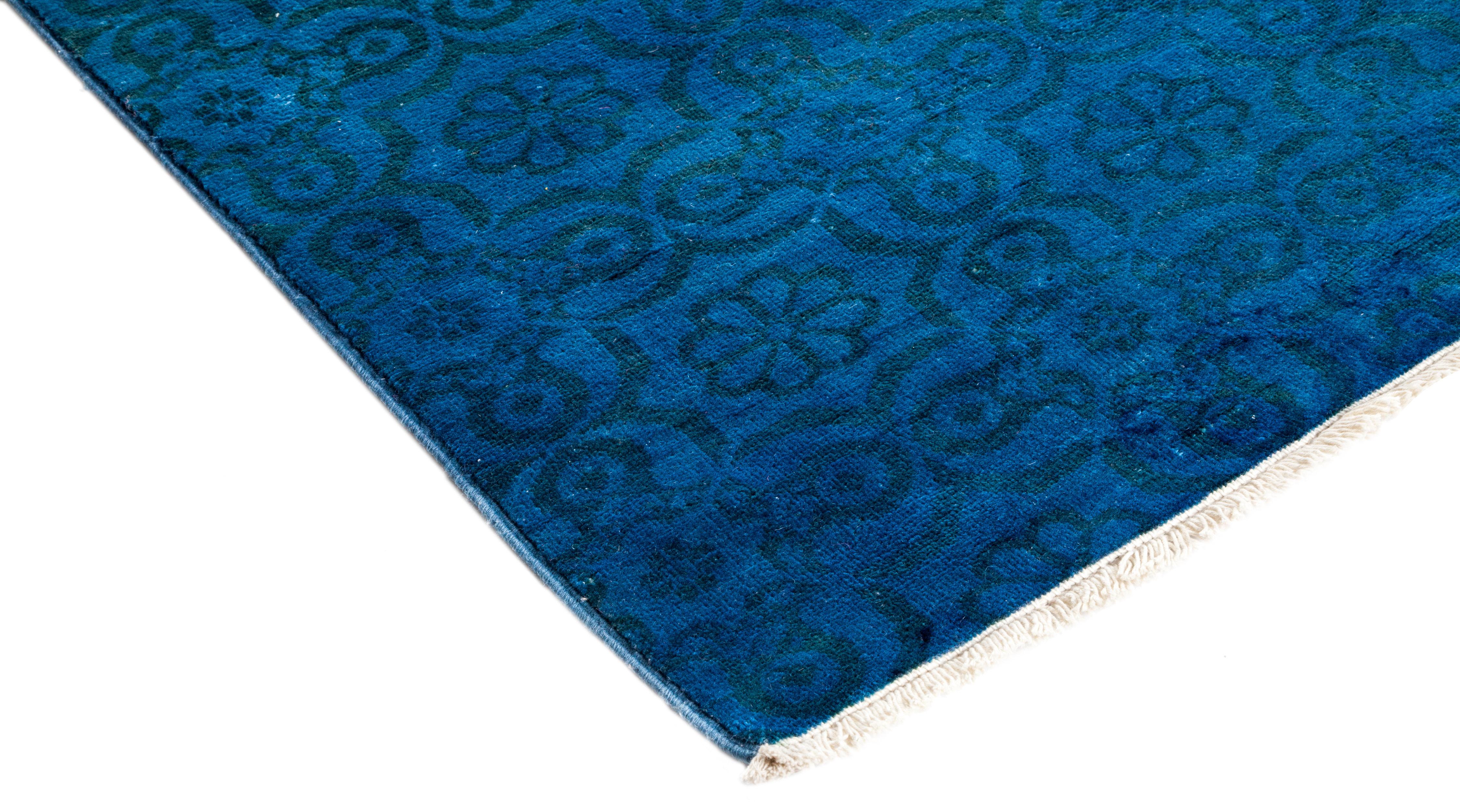 Color: Blue, made in Pakistan. 100% wool. The colorful collection epitomizes Classic with a twist: traditional patterns overdyed in brilliant color. Each hand knotted rug is washed in a 100% natural botanical dye that reveals hidden nuances in the