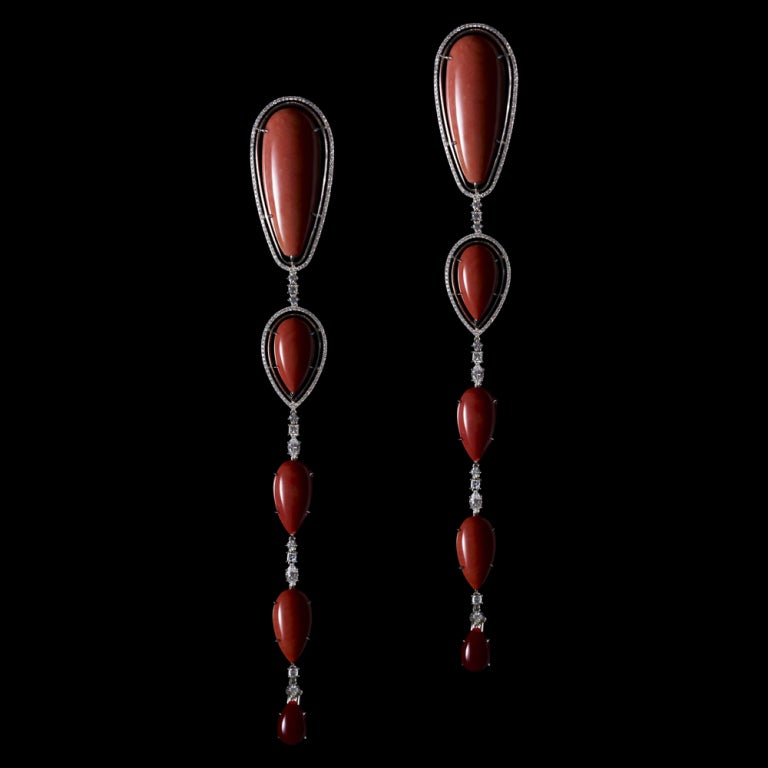 A pair of one-of-a-kind long drop earrings featuring Corals graduating in size from large to small, in color from pale pink to precious deep red, and surrounded by Alexandra Mor's signature 1mm knife-edged wire and floating Diamond melee. Earrings
