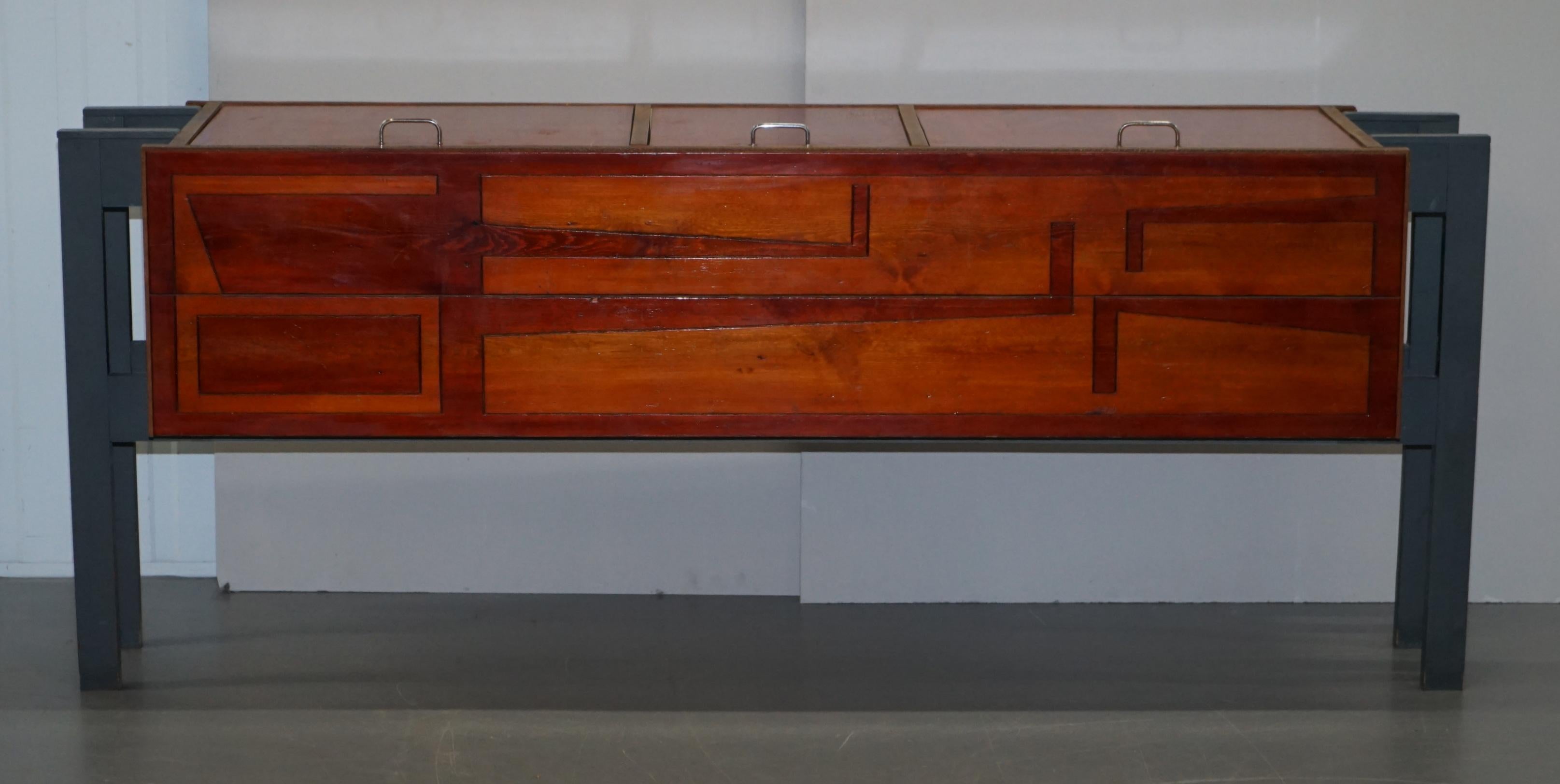 We are delighted to offer for sale this very interesting and stylish Art Modern sideboard which has been custom made

A very artist and creative piece, the style is like nothing I have ever seen, its very appealing. The doors all open upwards to