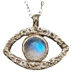 Colgante Ojo de Piedra de Luna Arco Iris en Oro en stock