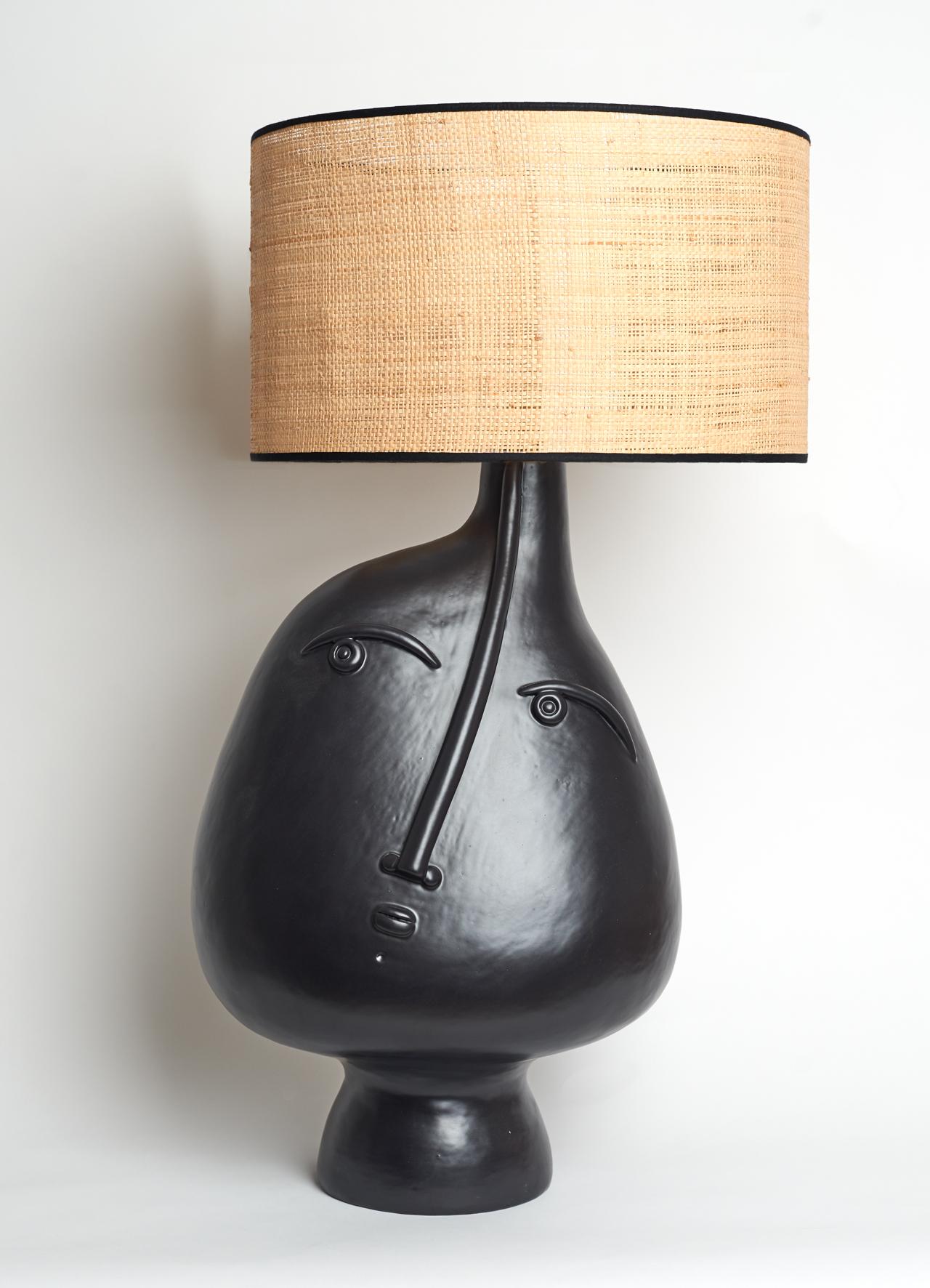 Hand-sculpted ceramic lamp base 

One of a kind stoneware piece glazed in black enamel signed by the French ceramicists Dalo 

The height dimension is for the ceramic sculpture solely 

Note to international purchasers:
This lamp-base has
