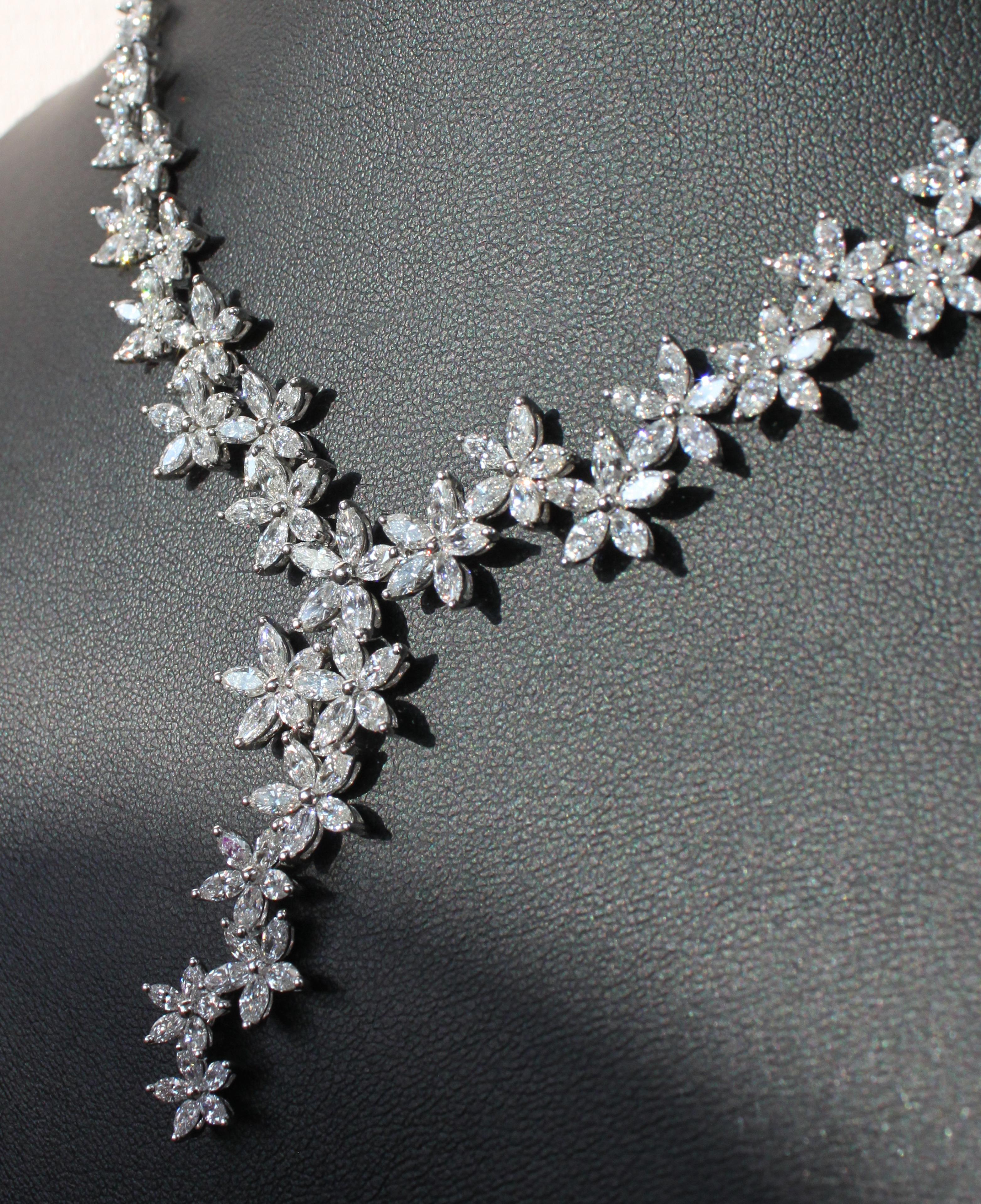 18K white gold
9.50ct natural marquise VS-SI diamonds
Total necklace weight 29.91 g

Crafted with unrivaled craftsmanship, this extravagant necklace embodies opulence and sophistication. Fashioned in luxurious 18K white gold, its design is a
