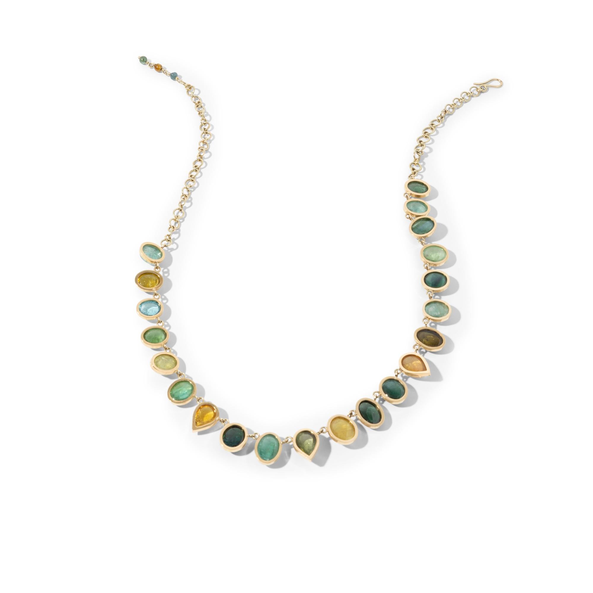 One-of-a-kind handcrafted 18kt yellow gold necklace with 21 cabochon (smooth) cut tourmalines in green, yellow, and blue in different shapes. These exquisite stones all vary slightly in size and shape and the colour scheme of green to blue hues