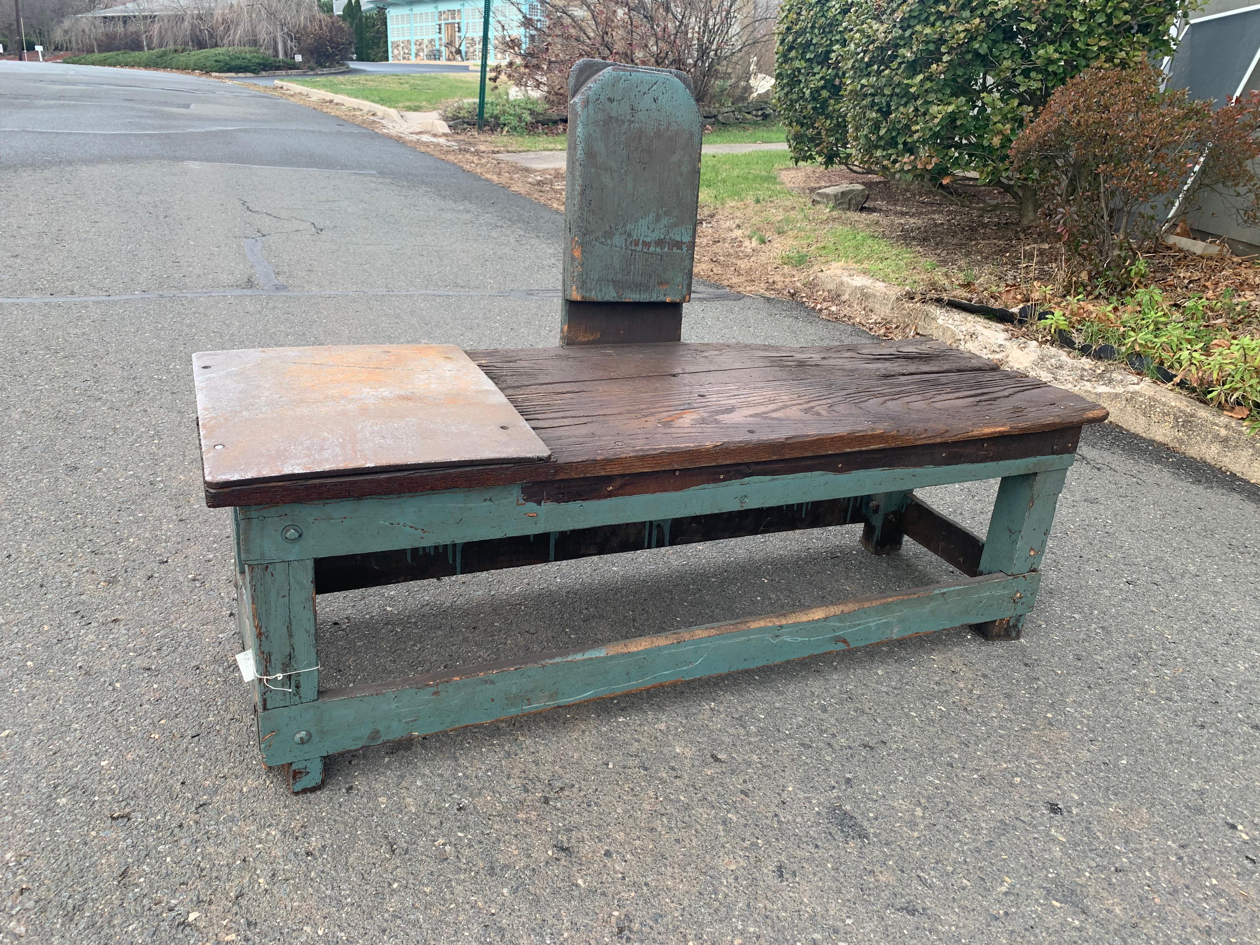 Cool rustic industrial one of a kind handmade work bench having distressed painted turquoise base, natural stained wood seat with copper panel, and wood and metal seat back.
Measures: 37.5 H with back.