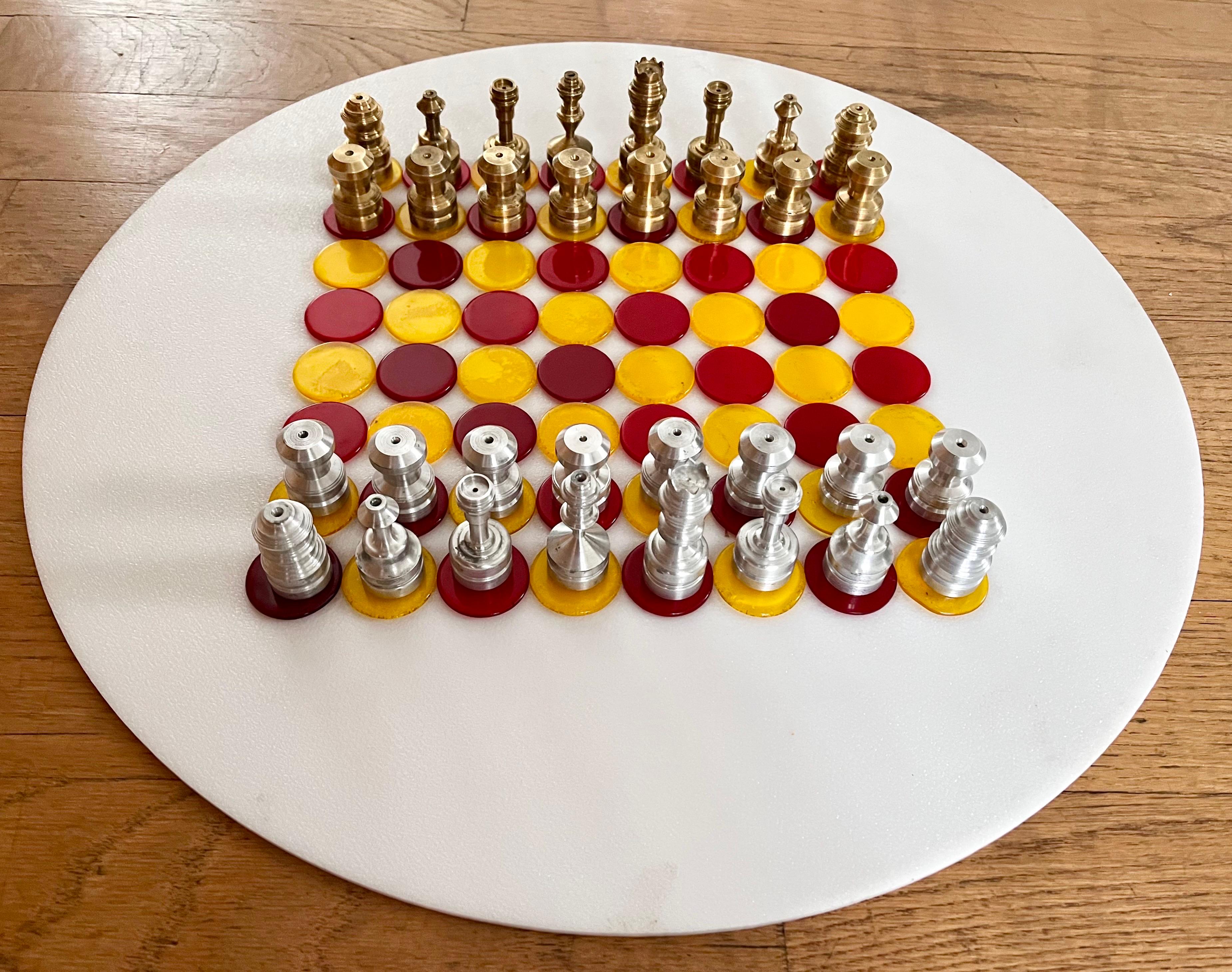 Industrial Pop Art Chess Set

chess pieces:
industrial solid brass and aluminum
custom made in a machine shop 
pawn - shortest piece is 1 1/2