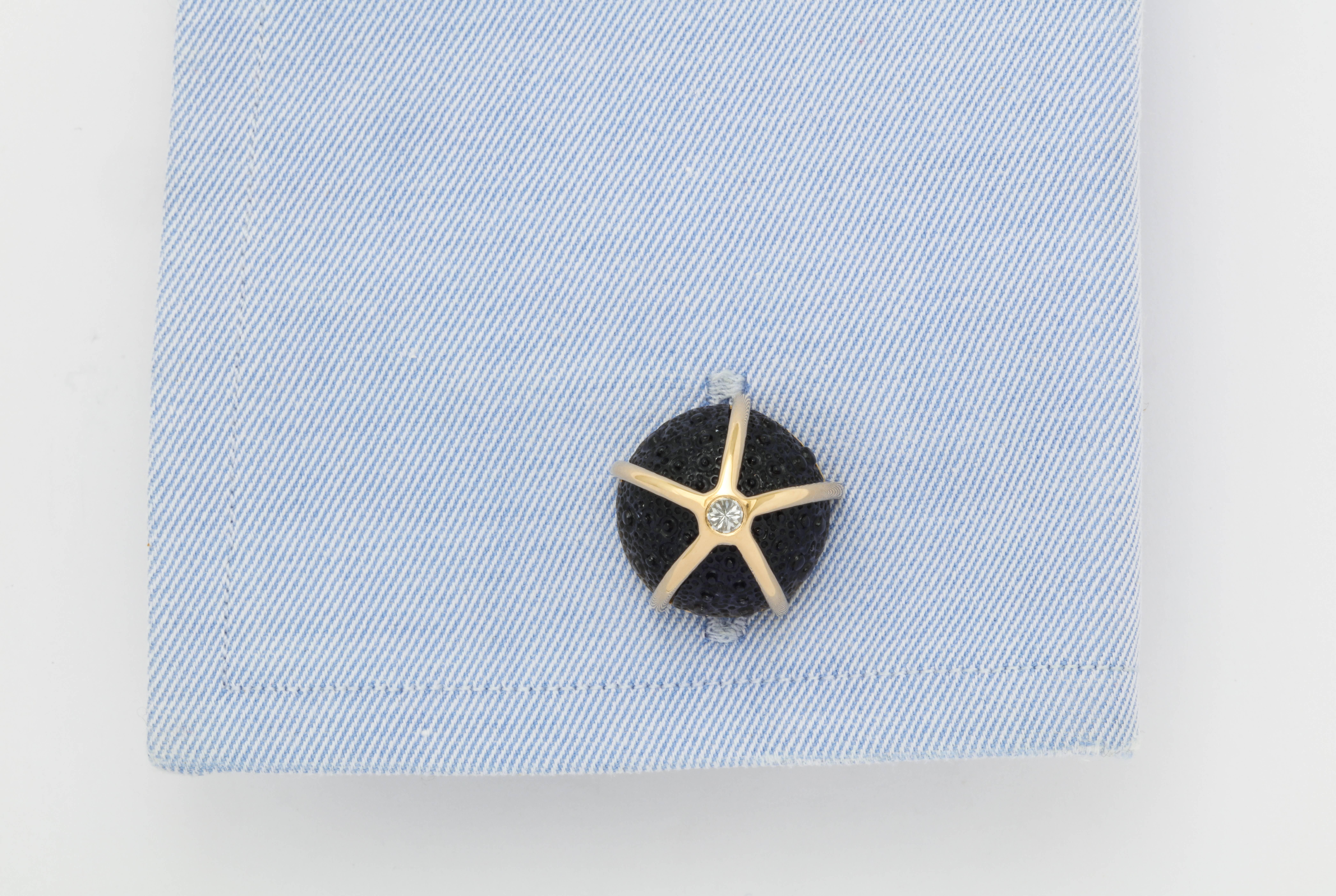 One of a kind, expertly carved, iolite and reverse set diamond cufflinks.  The deep blue color of the iolite shows all of the fine details of the carving, while the diamond that is set upside down adds a unique touch.  The reverse side features a