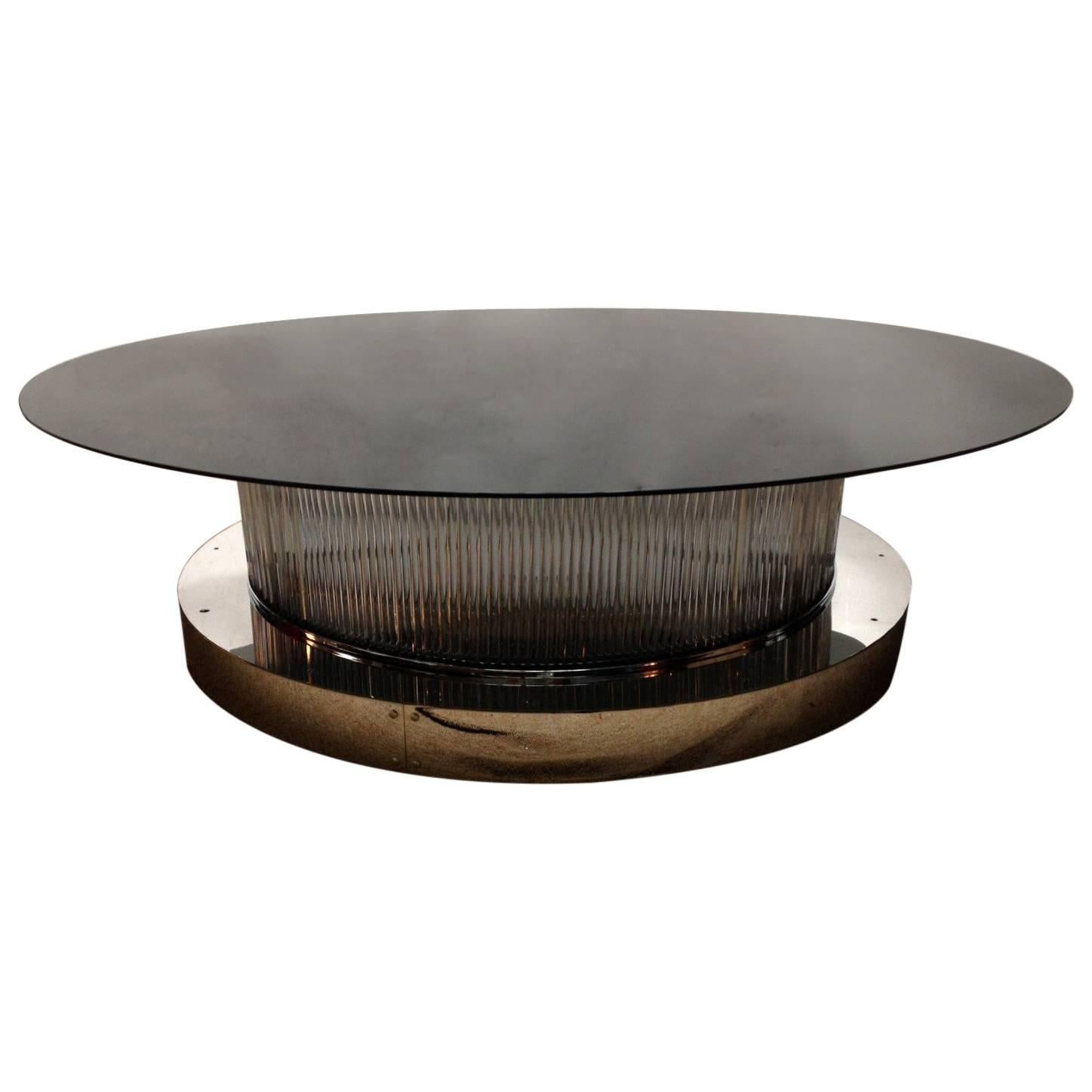 One of a kind Italian over sized crystal bars coffee table with chrome base and glass top. This table can be lit up from inside with its six standard light sockets wired for the U.S. / Made in Italy circa 1990s

Top glass diameter is 60 inches /