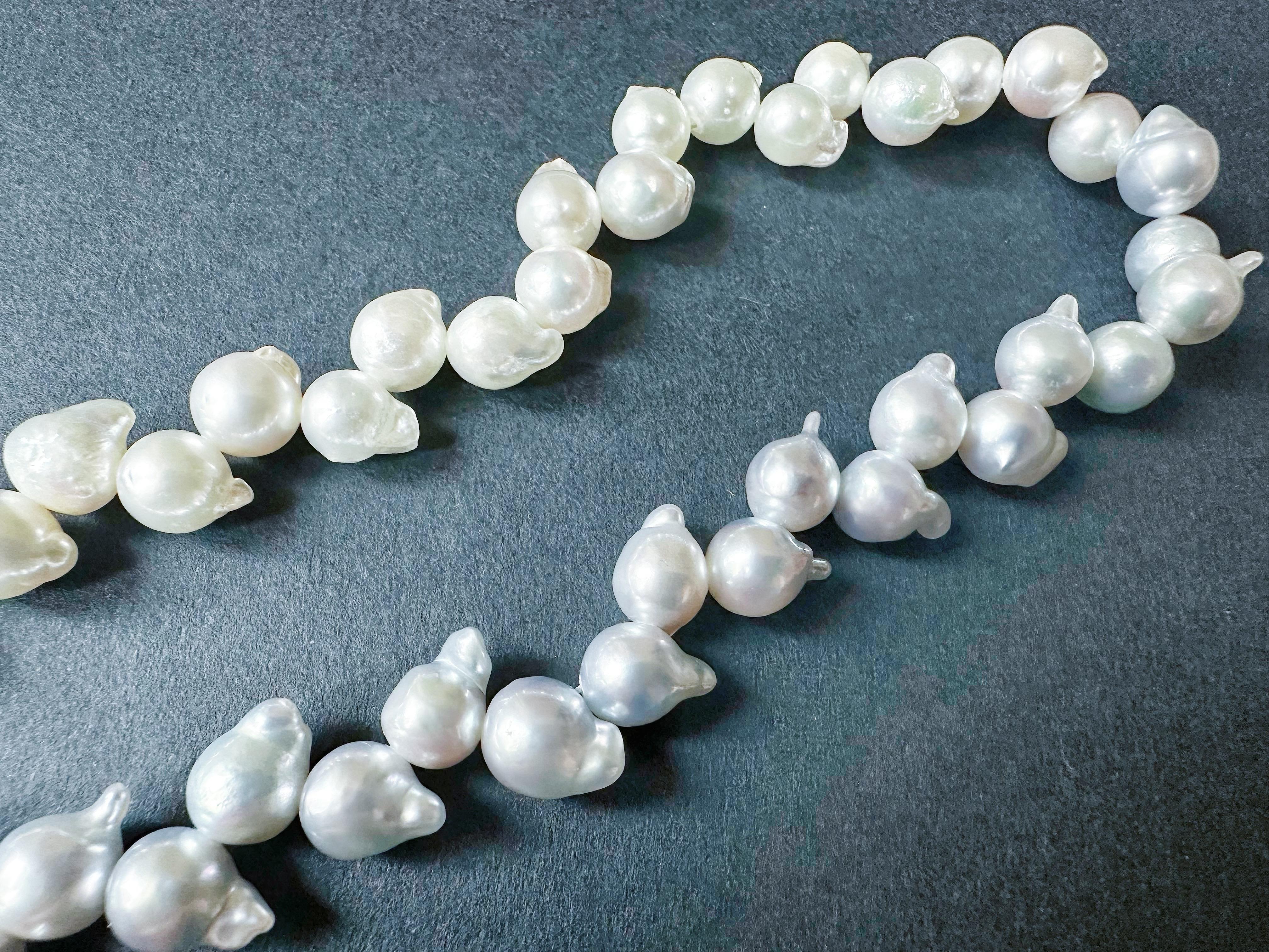 Introduce a touch of elegance to your jewelry collection with our One-of-a-Kind Japan Akoya Pearl Long Necklace. This extraordinary piece features a beautiful blend of white akoya pearls and grey pearls with a captivating blue tint, creating a