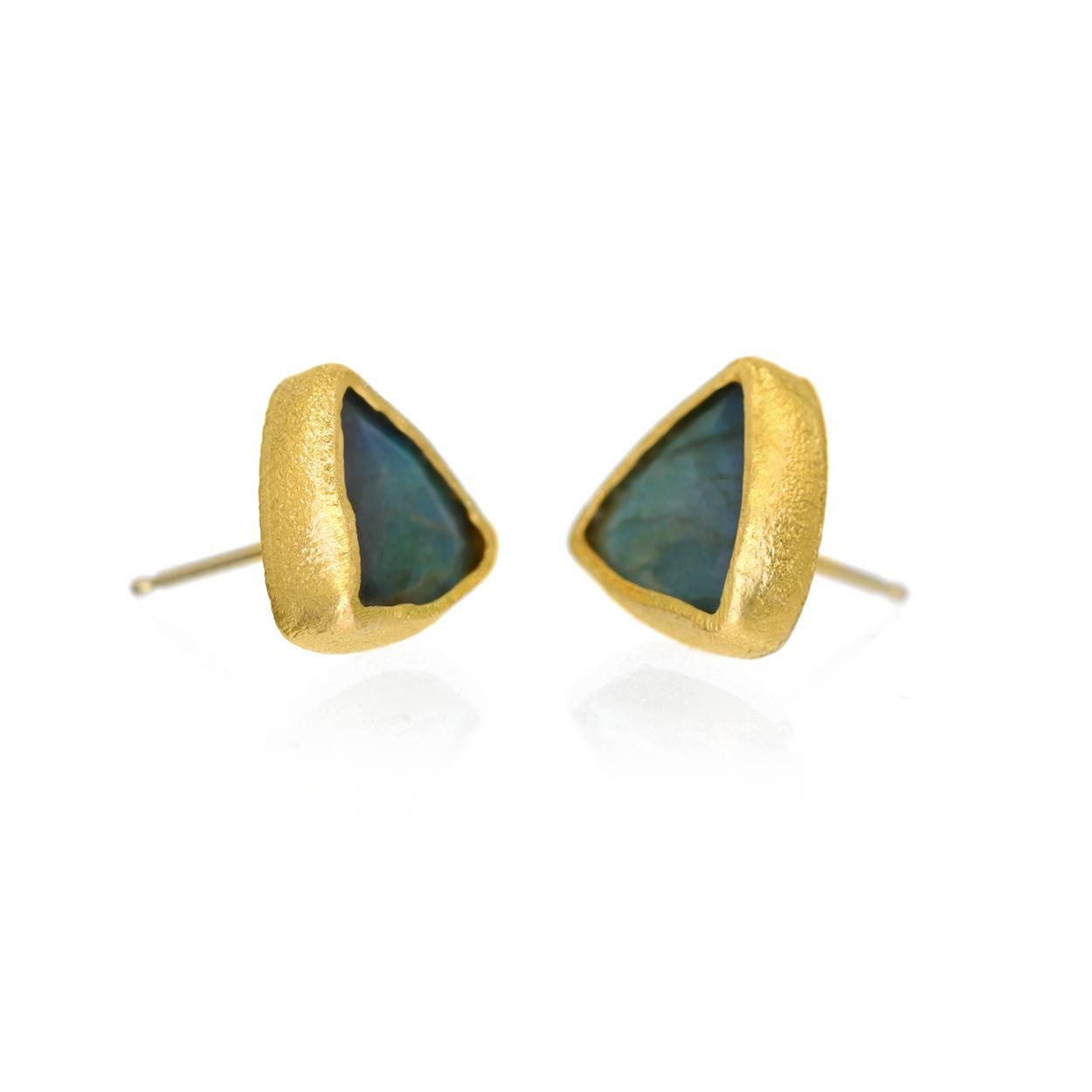One of a Kind Stud Earrings handcrafted by acclaimed jewelry maker Devta Doolan in signature-finished 22k yellow gold showcasing a beautiful matched pair of shimmering, flashy faceted labradorite triangles, and finished with 18k yellow gold posts