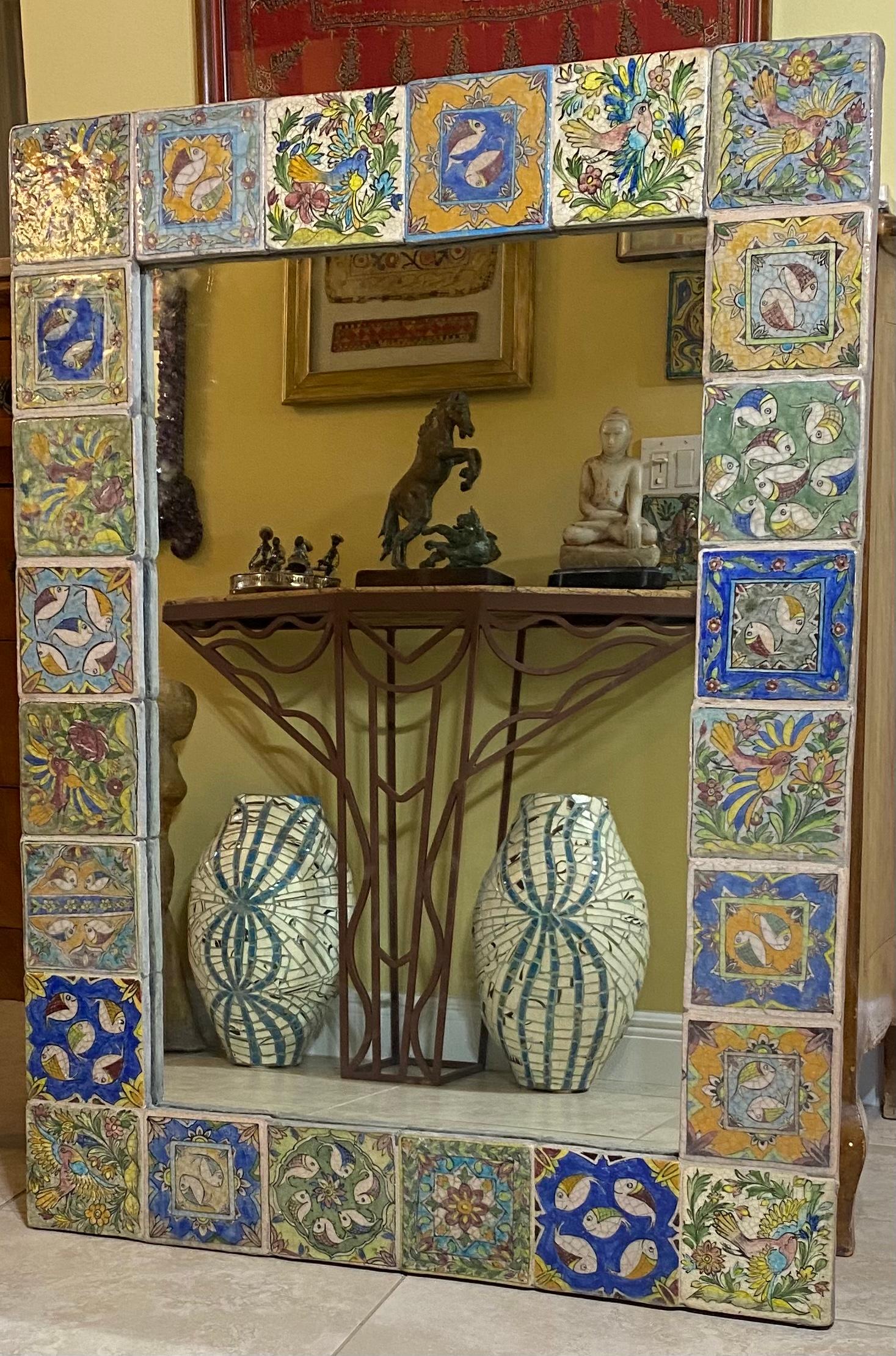 Beautiful large mirror made of hand-painted and glazed ceramic tiles, with exceptional motifs of vines flowers fish and birds. Great object of art for wall display.
Total weight : 60 pounds
Glass mirror size only :23” x 34”.
 