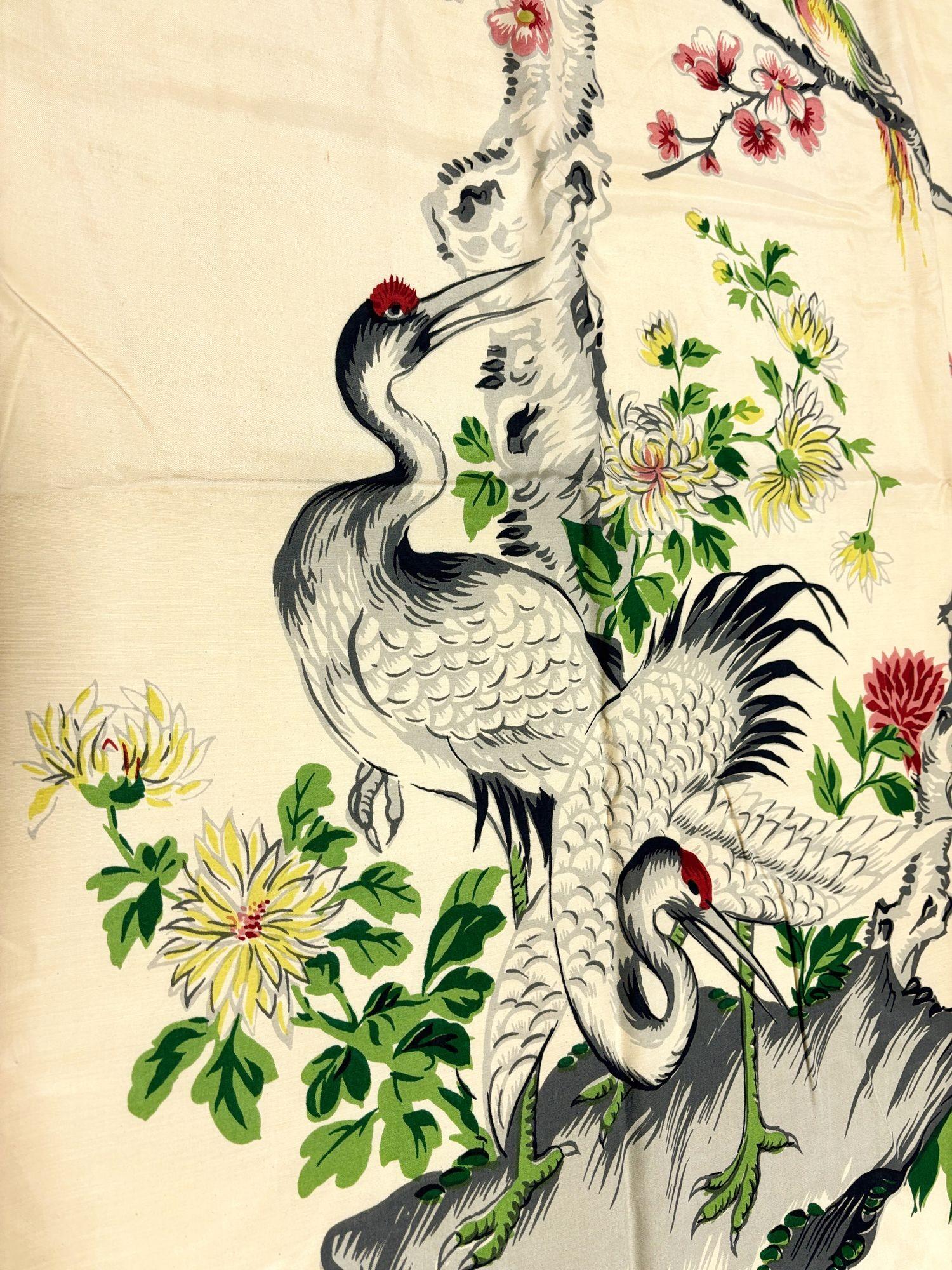 This vintage silk single-panel curtain features an exquisite scene of two cranes beneath a pine tree, surrounded by blooming chrysanthemums and plum blossoms. A colorful bird perches on a branch, adding a touch of liveliness. Rich in symbolic motifs