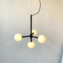 One of a Kind Modern Black Chandelier with Four White Glass Globes