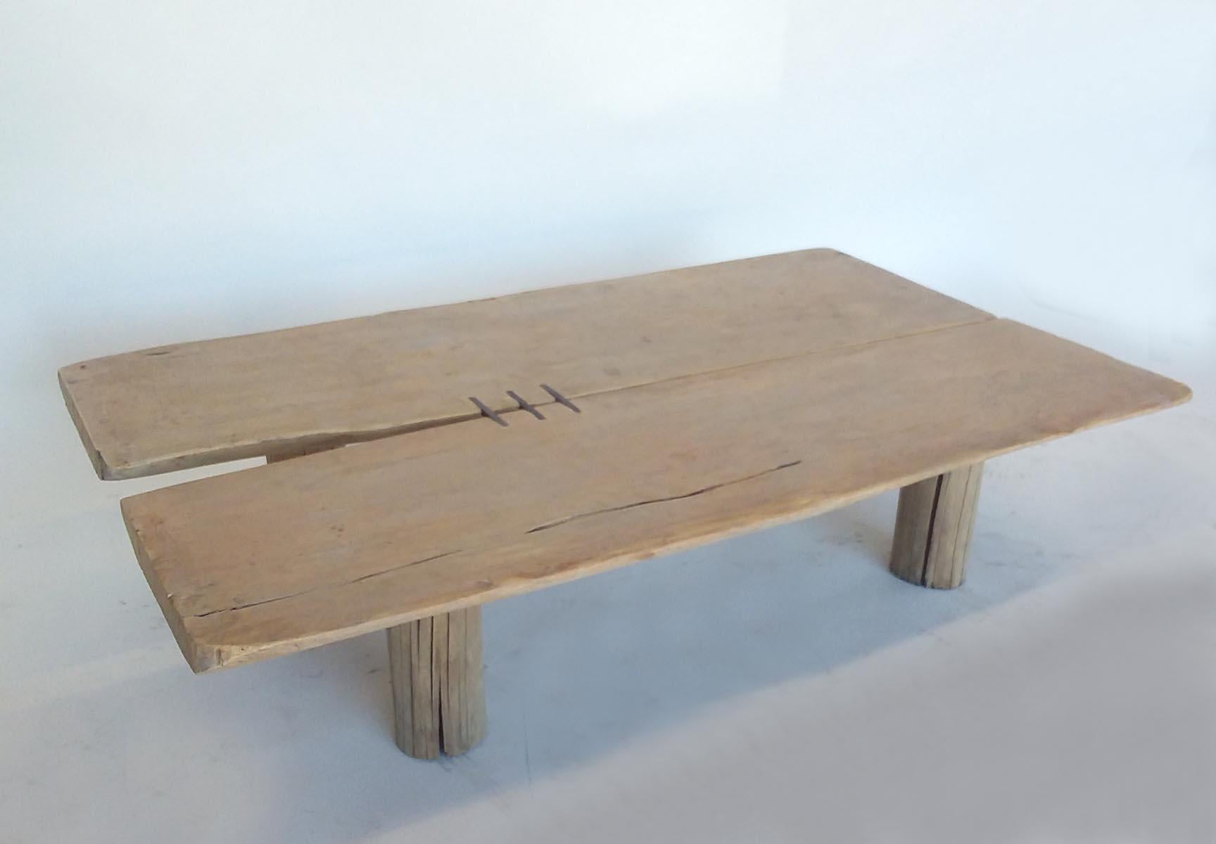 Rustic, yet modern, simple and elegant low coffee table consisting of two organic shaped boards connected to make one surface. Three inlaid hand forged pieces of iron. Wood is very smooth, worn and has a light patina. This is a one of a kind piece