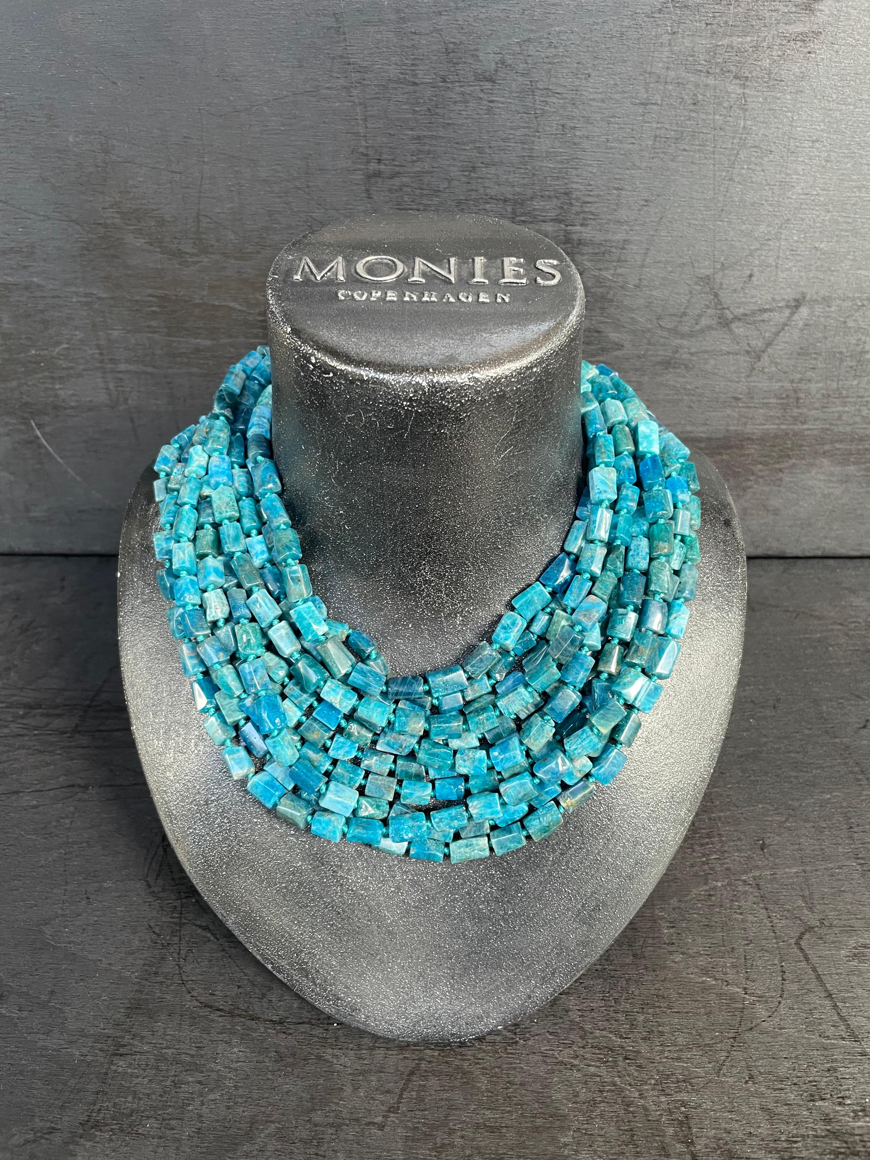 One-of-a-kind statement necklace from the Danish jewellery brand, Monies. 
Made in Blue Chrysolite, Lapis Lazuli & Horn with a leather clasp. 

Handcrafted in the Monies Atelier in Copenhagen.