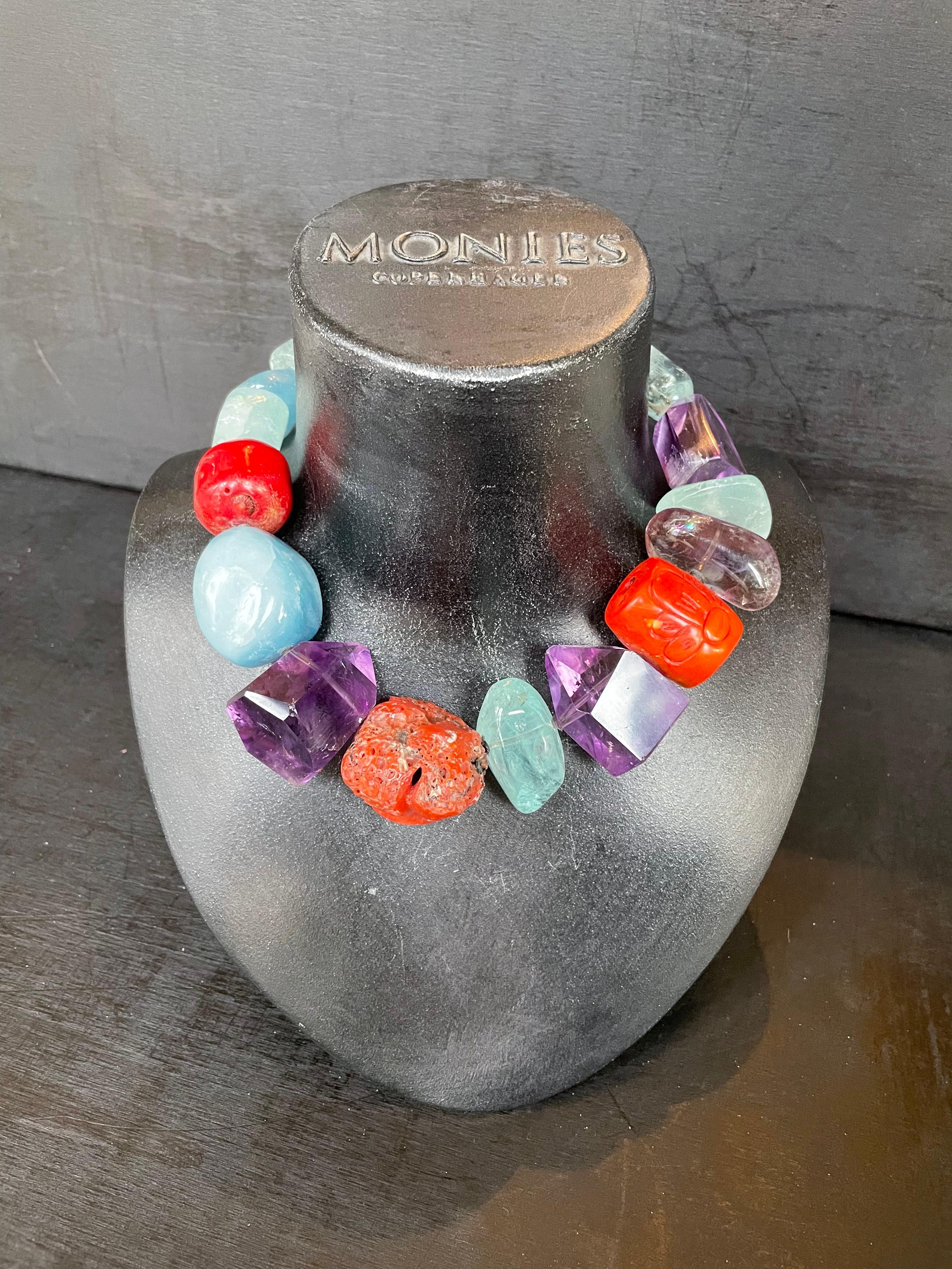 One-of-a-kind statement necklace from the Danish jewellery brand, Monies. 
Made in Aquamarine, Italian Coral, Amethyst and Chalcedony with a leather clasp. 

Handcrafted in the Monies Atelier in Copenhagen.