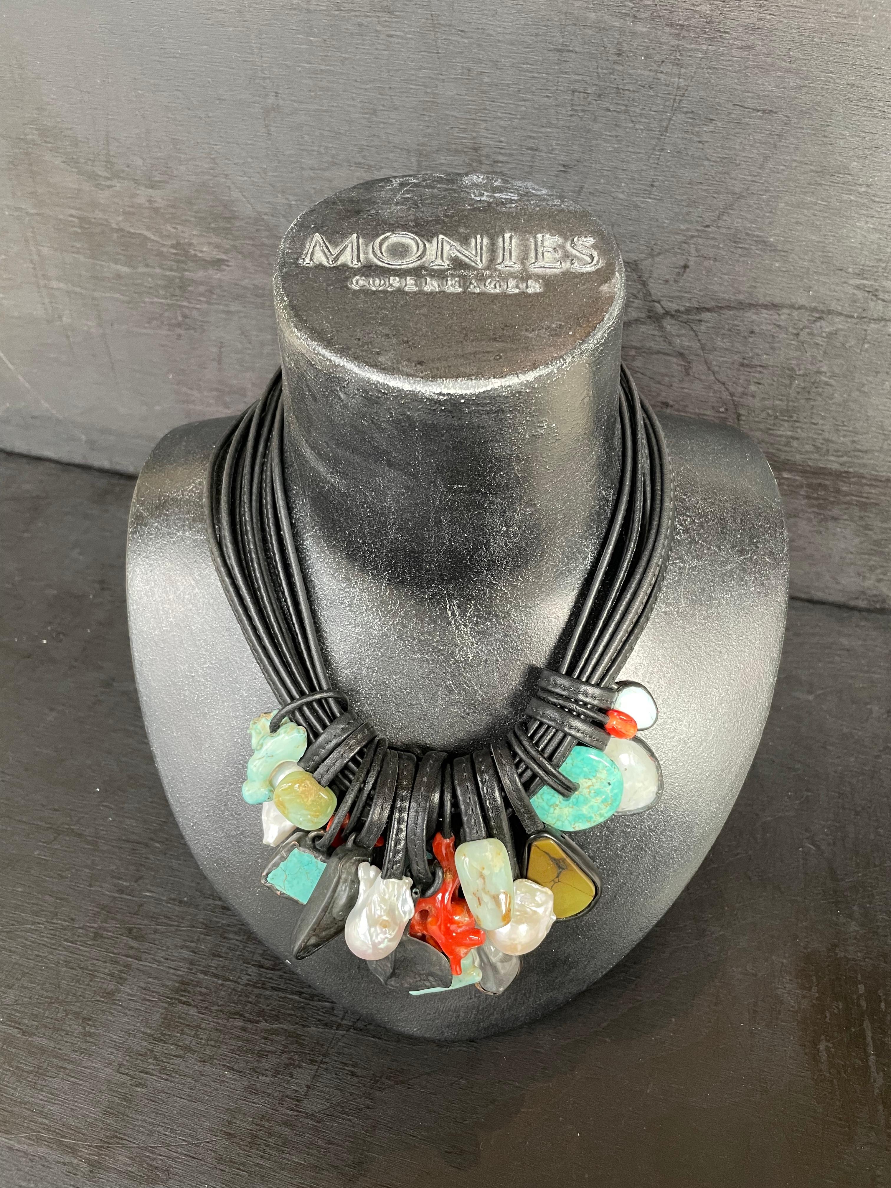 One-of-a-kind statement necklace from the Danish jewellery brand, Monies. 
Made in Italian coral, turquoise, rock crystal, baroque pearls, copper and leather, with a leather clasp. 

Handcrafted in the Monies Atelier in Copenhagen.