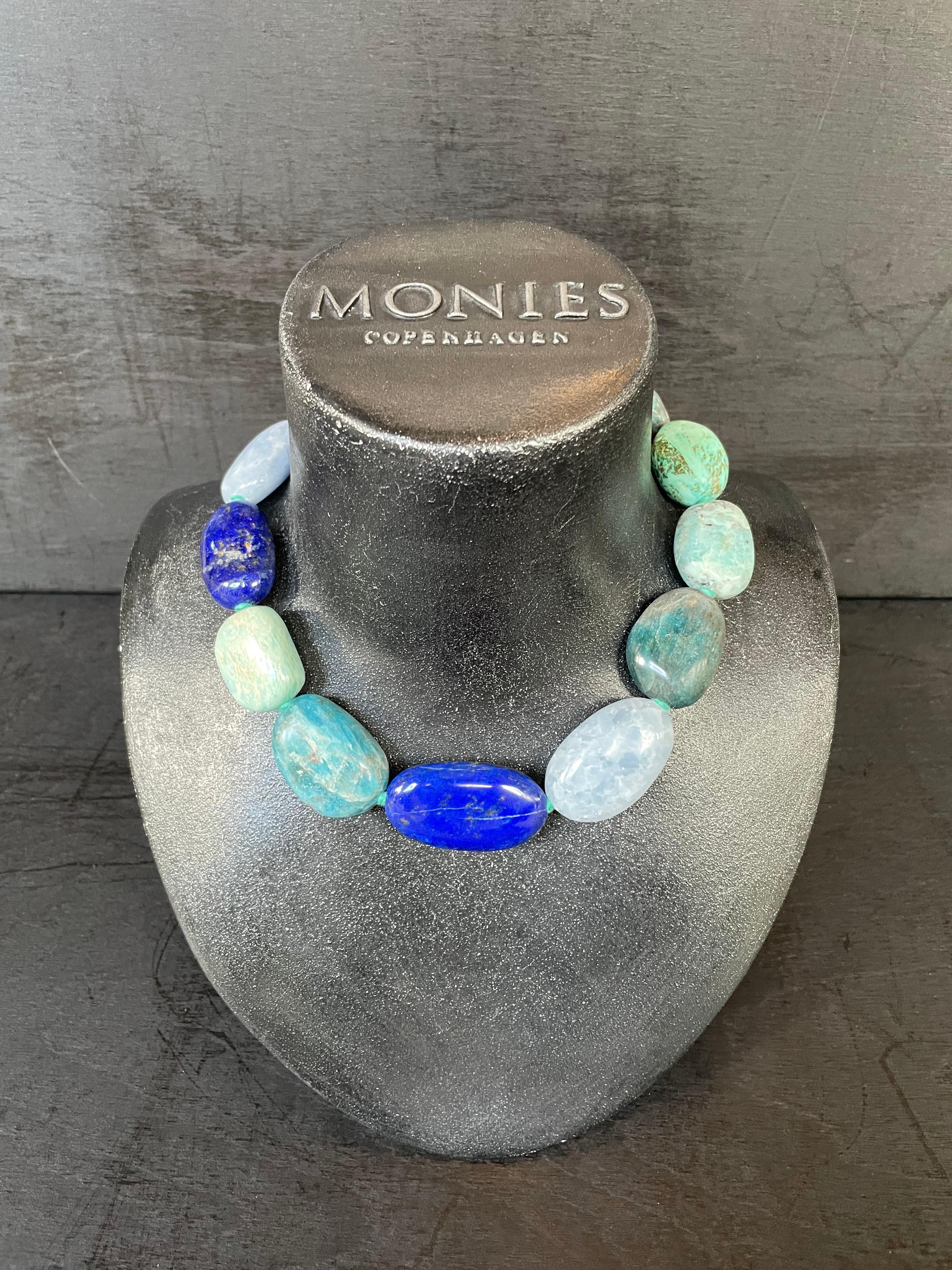 One-of-a-kind statement necklace from the Danish jewellery brand, Monies. 
Made in Celestine, Apatite, Turquoise & Lapis Lazuli with a leather clasp.

Handcrafted in the Monies Atelier in Copenhagen.