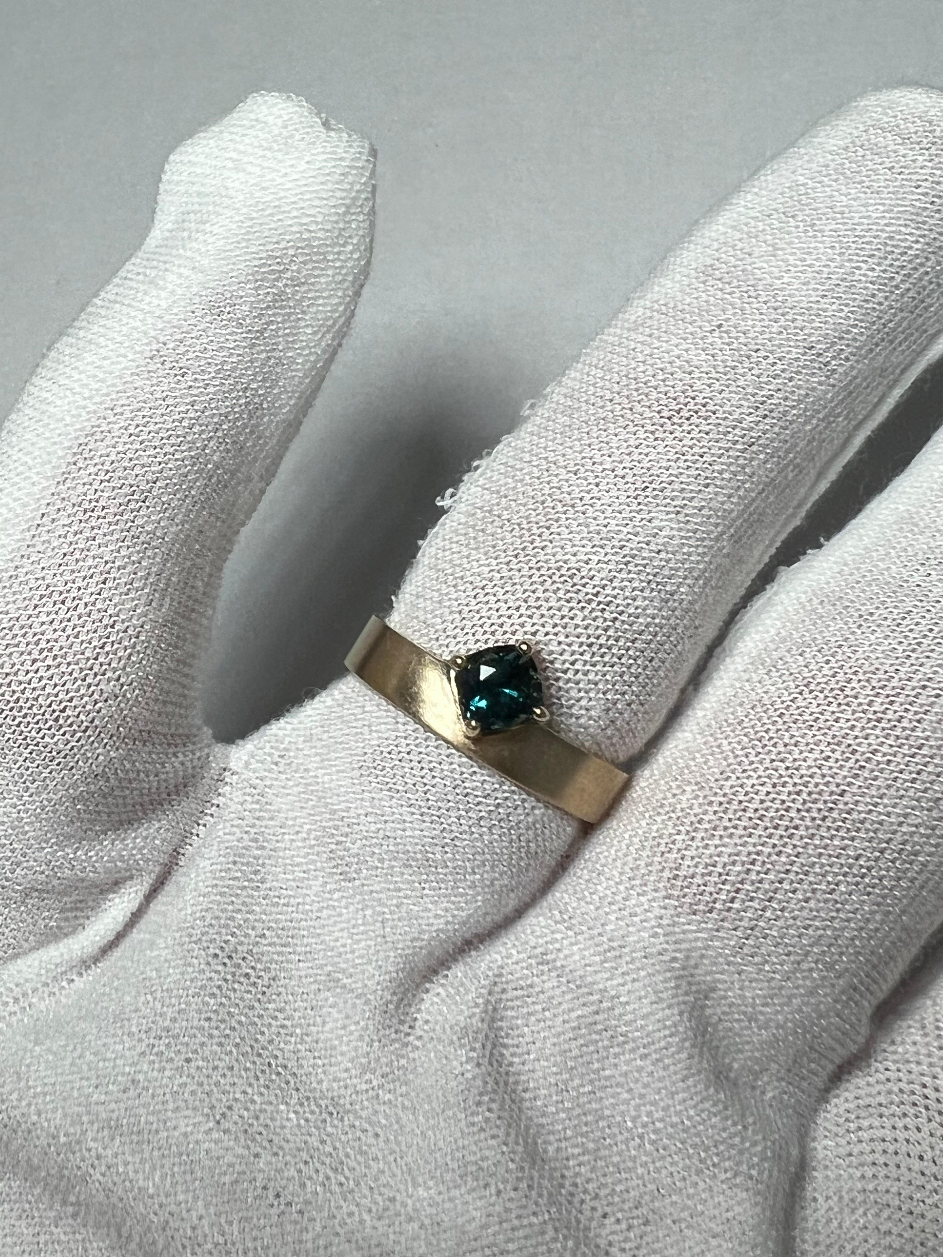 Modern One of a Kind Off Set Cushion Teal Sapphire Solitaire Ring. For Sale