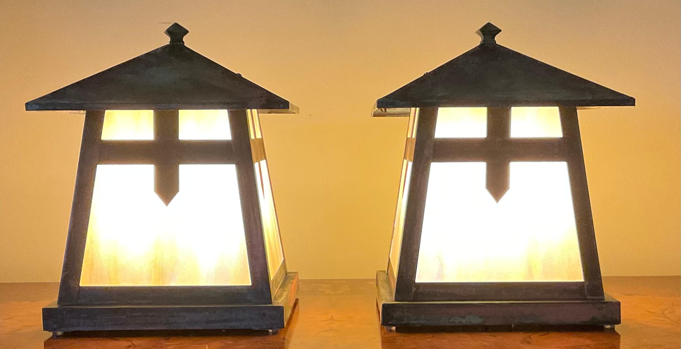 Beautiful pair of table lamps made of solid copper decorated with art glass on four sides , newly electrified with one 60/watt light each lamp.
This pair originally was post lantern for the entrance of a house , and professionally converted to