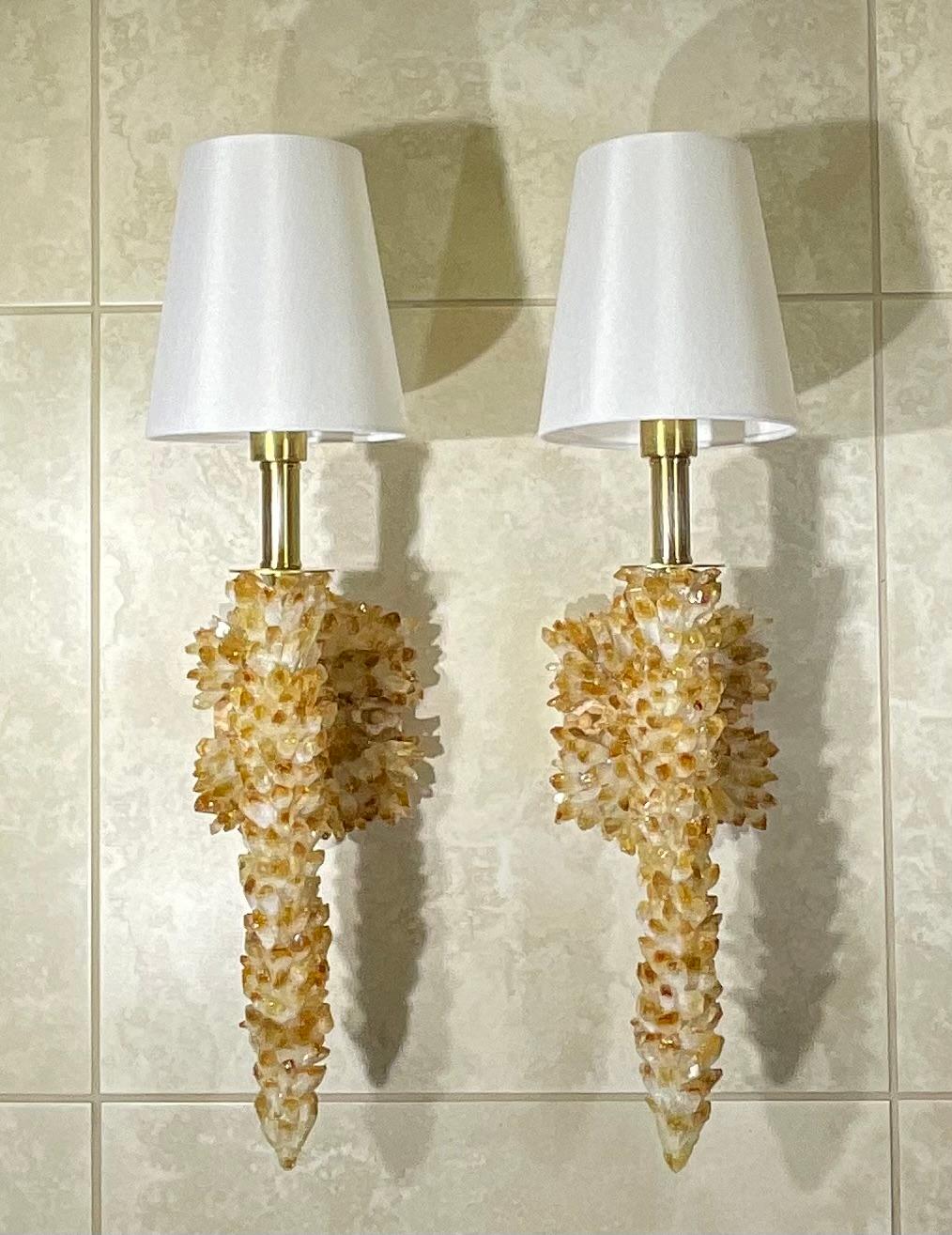 One of a kind 
Exceptional pair of wall sconces artistically made of small real citrine crystals  point,  one 40/watt light each light .
Beautiful object of art for work display.

