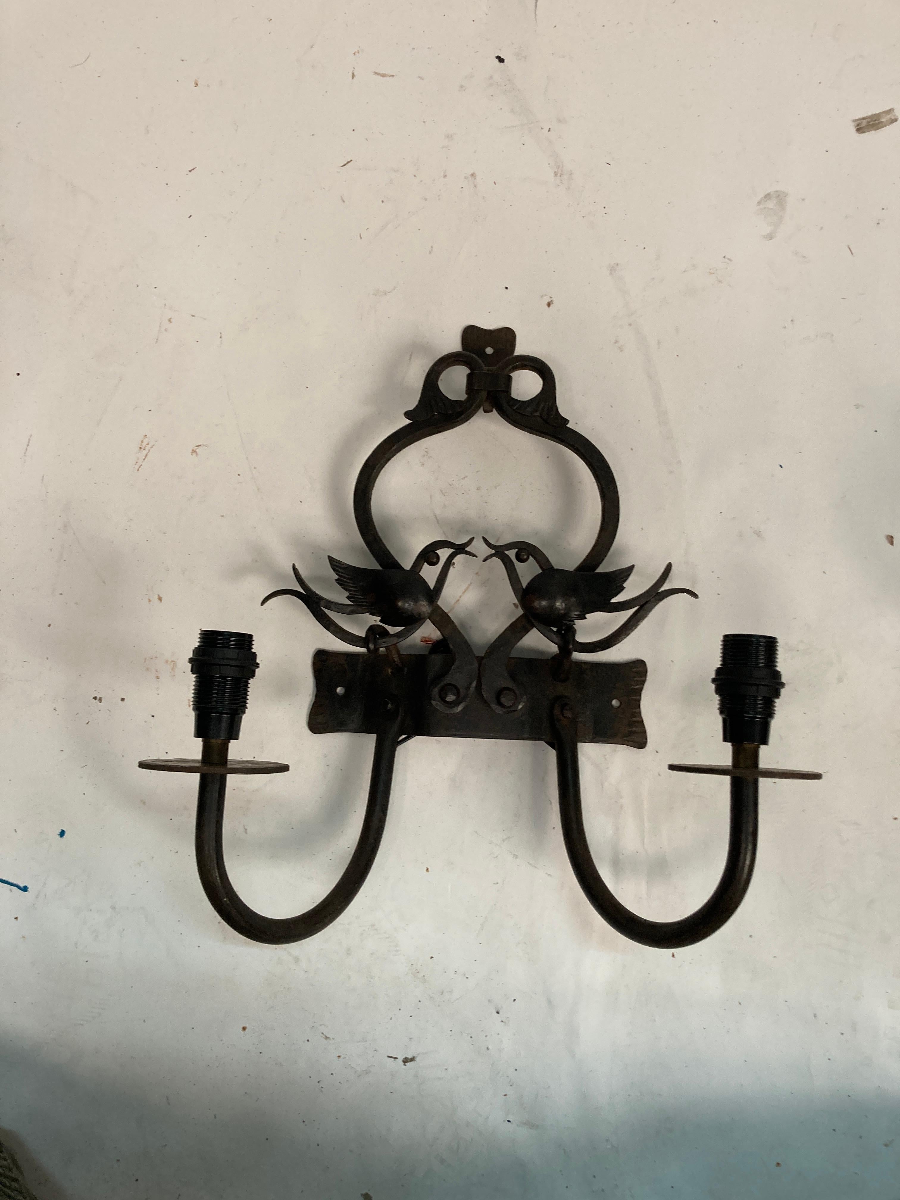 Pair of wrought iron handcraft sconces
Showing two birds kissing
Re-wired
