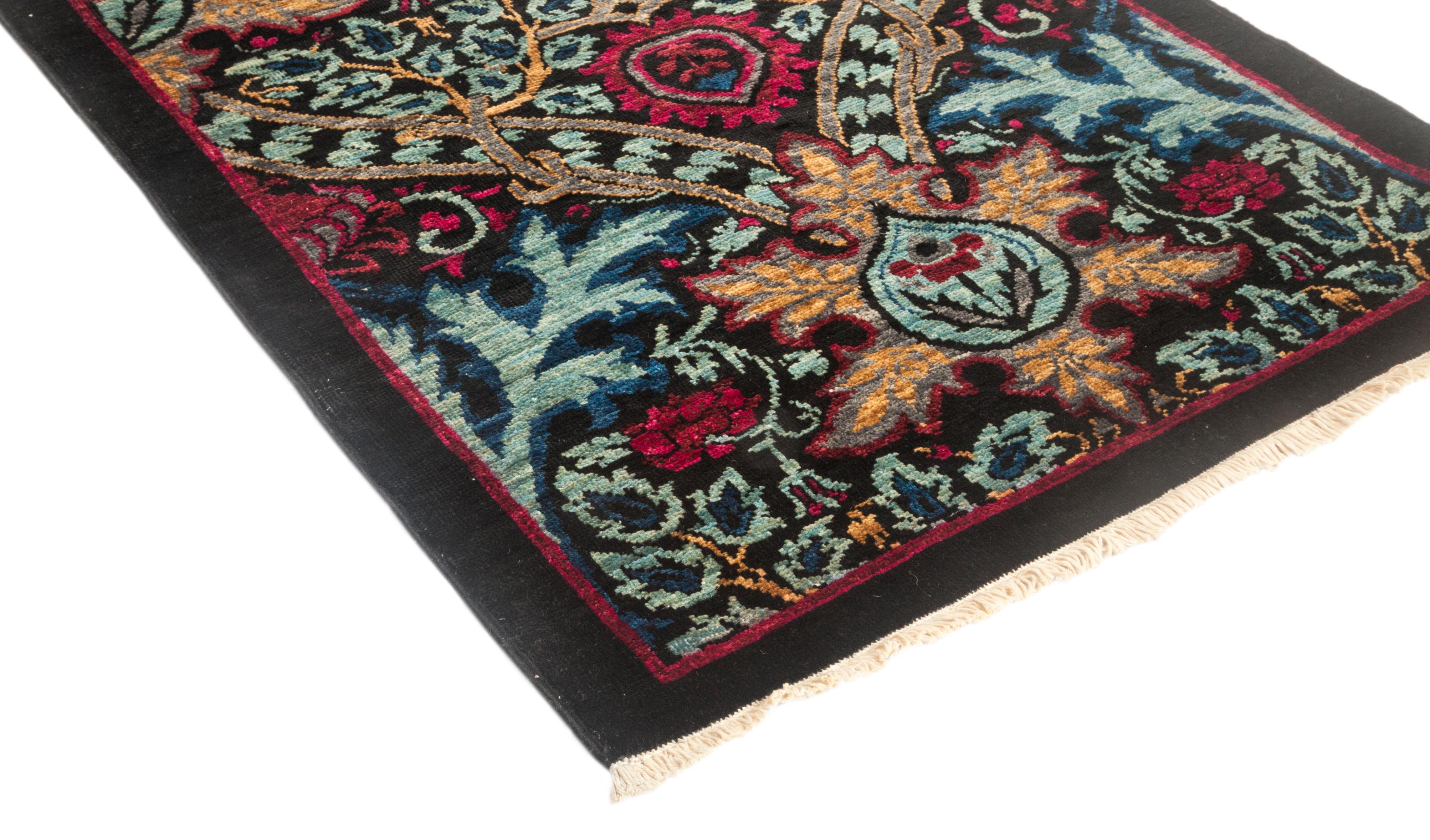 Color: Black - Made in: Pakistan. 100% wool. Whether boasting a field of flowers or ancient tribal symbols, patterned rugs are the easiest way to enrich a space. Subtle colors and intricate motifs reinforce the quiet sophistication of a traditional