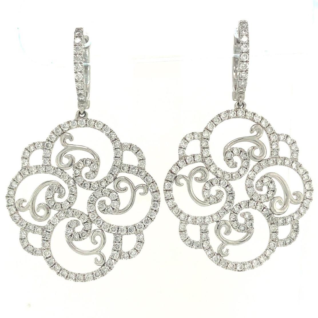 This One Of A Kind Diamond Filigree Swirl Drop Earrings Set in 18K White Gold, features a beautiful, large swirls design boasting 3.89 carats of Pavé-set diamonds with F Color VS1 Clarity. Crafted with an excellent make and polish, the top of these
