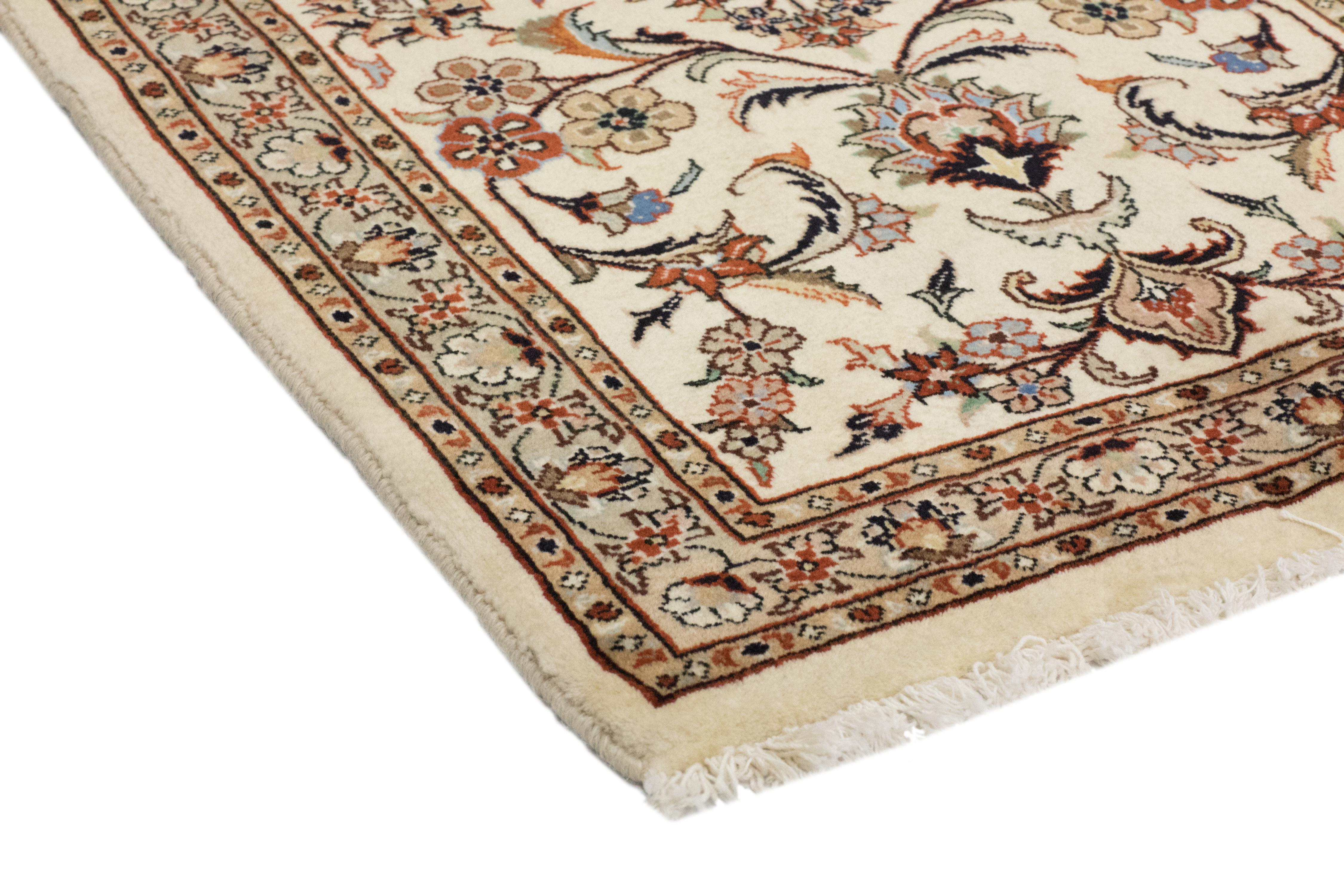Color: Ivory, made in Persia. 100% wool. Finely knotted, with jewel-tone colors and extravagant patterns, Persian rugs accentuate the grace and gravitas of traditional rooms while adding a touch of Bohemian allure to Minimalist or contemporary