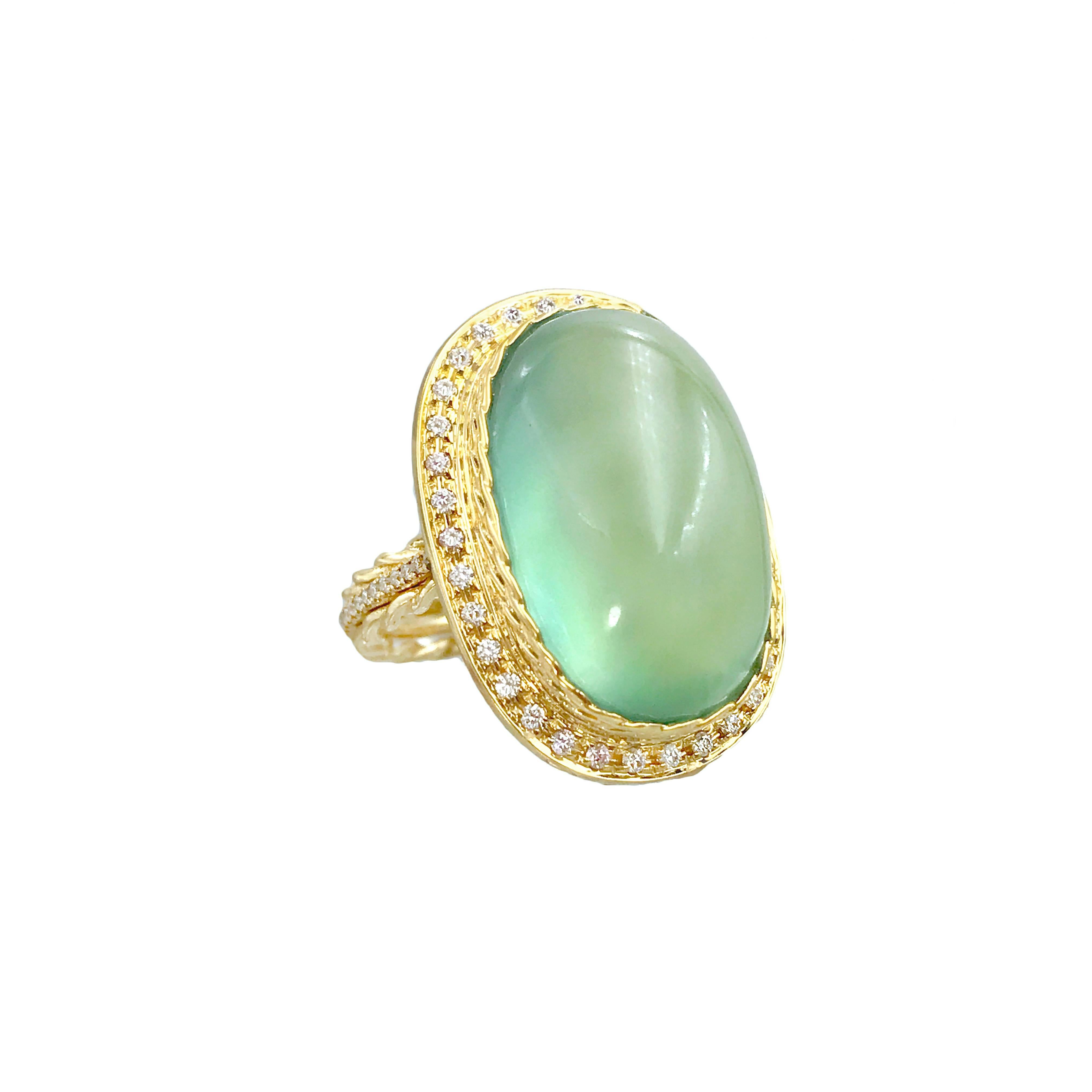 Prehnite Diamond Halo Cocktail Ring set in 18K Yellow Gold in size 6 with 0.629 CTW Diamonds. It's in stock and ready to ship.

This lovely prehnite cab is 18mm x 12mm, weight 16.14 CT, set in JeweLyrie signature double twist bezel, halo-ed with 86