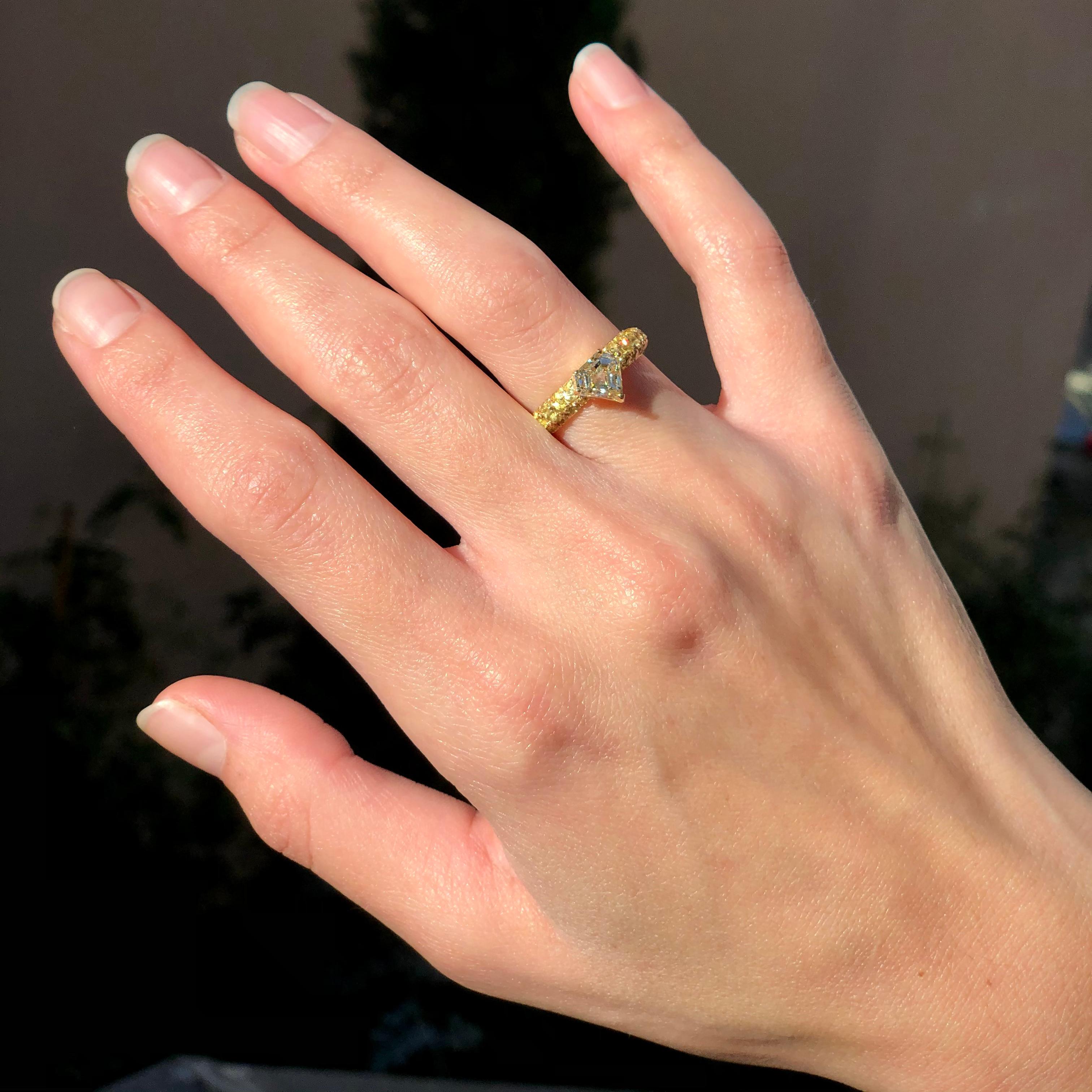 A modern & edgy 1.17ct one-of-a-kind diamond ring by Ralph Masri set on a yellow sapphire pavé (2.50ct) ring shank. A true stunner as a cocktail ring or as an engagement ring.

Size 52 (US 6)