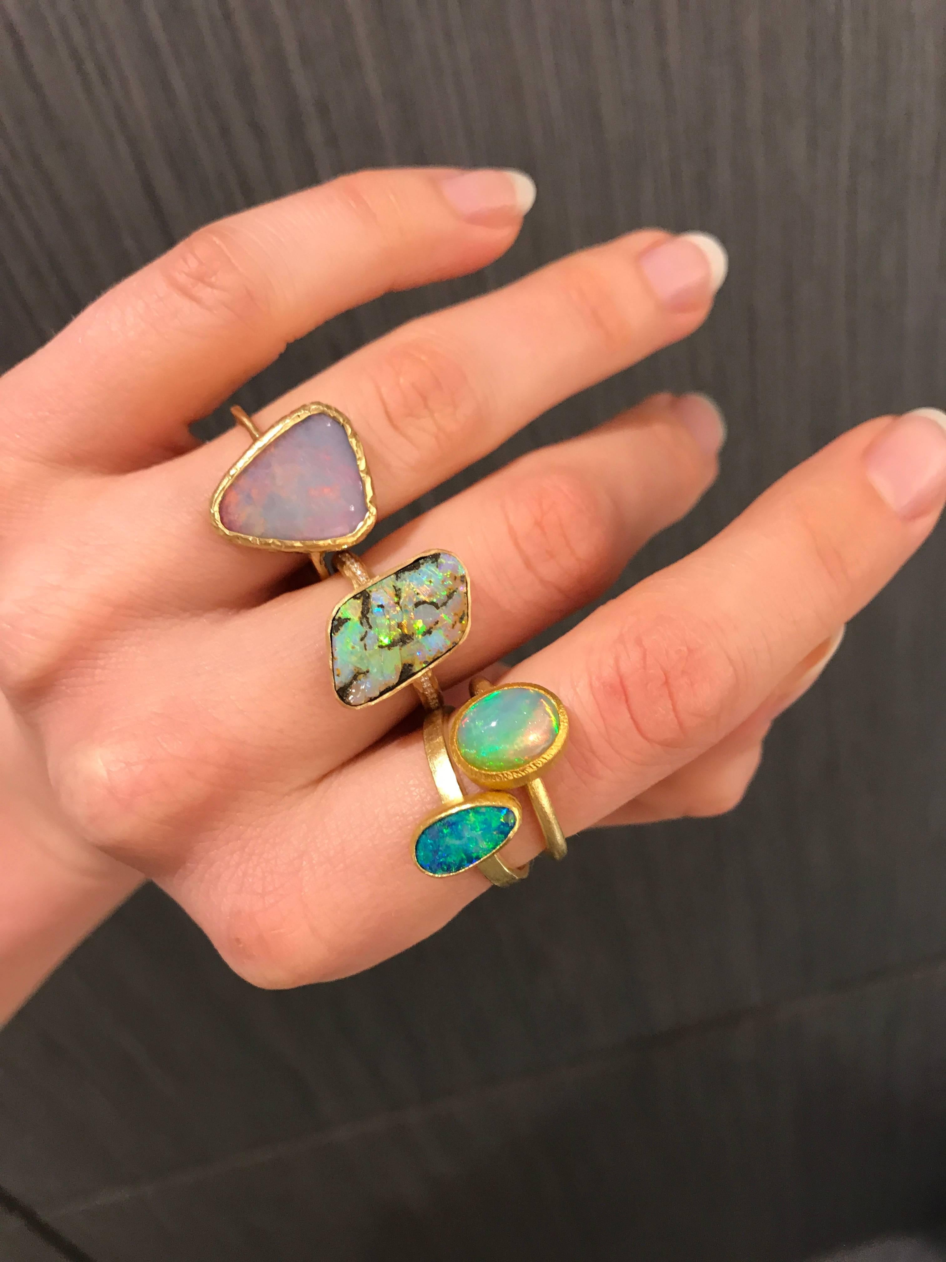 One of a Kind Ring by jewelry designer Page Sargisson handmade in 18k yellow gold featuring a truly special Austalian boulder opal in a unique violet hue with an intense primary orange and red flash and additional color flashes of blue, green,