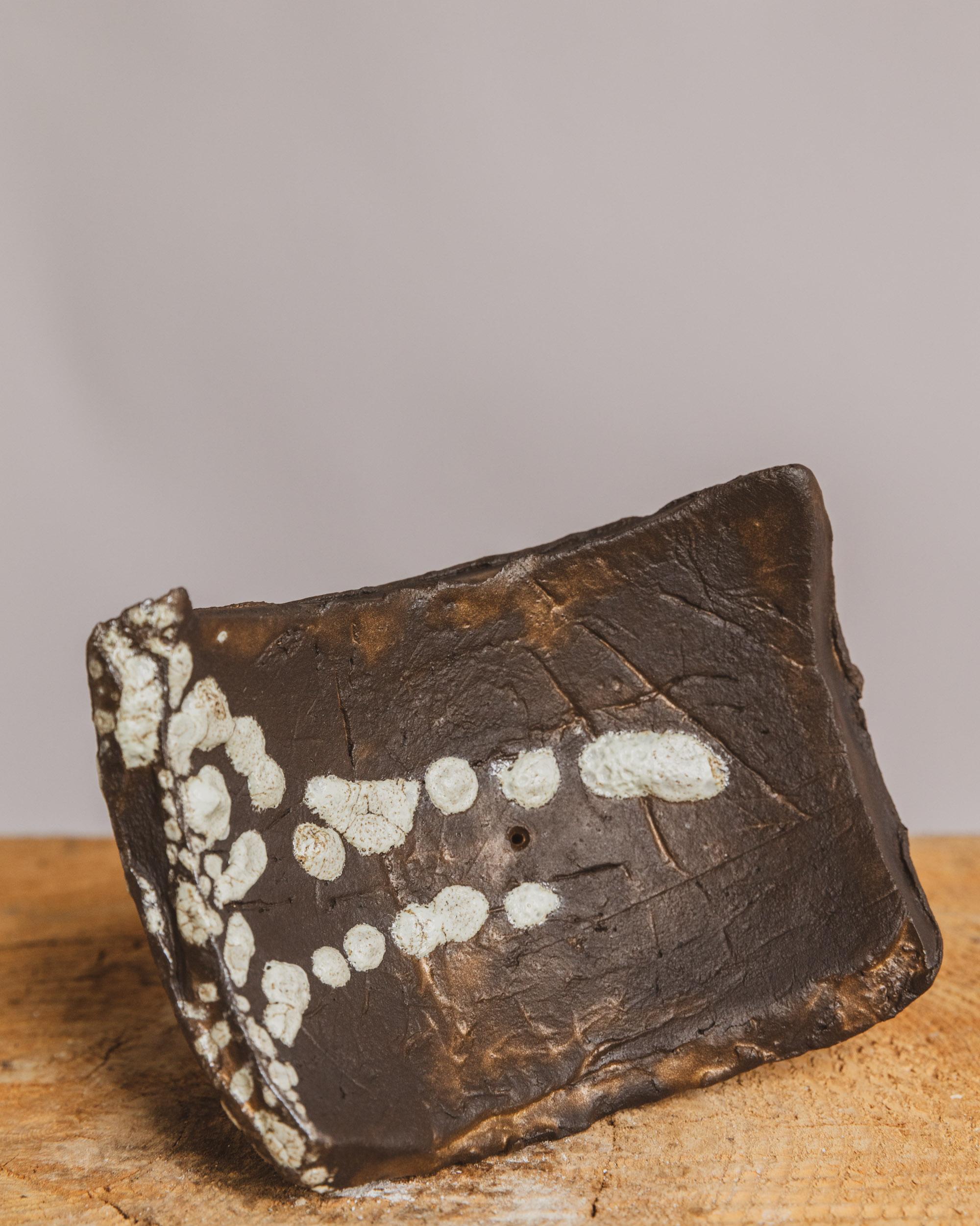 Ritual Tray by Ilona Golovina

Hand built from groggy stoneware, this sculptural tray by Ilona Golovina embodies the quiet power of ritual and the beauty of imperfection. Elevated by an organic pedestal base, the asymmetrical, half-moon surface