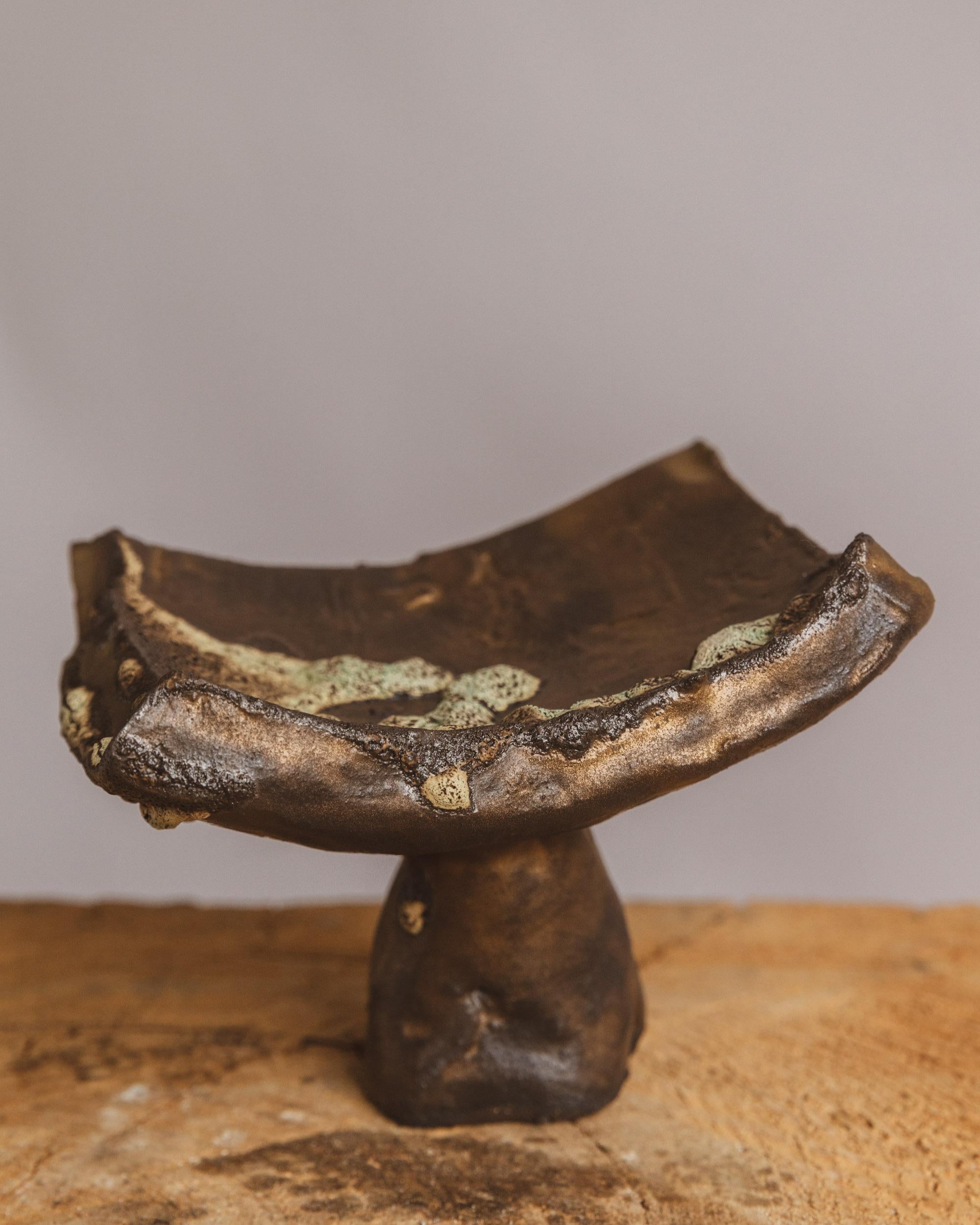 Ritual Tray by Ilona Golovina

Hand built from groggy stoneware, this sculptural tray by Ilona Golovina embodies the quiet power of ritual and the beauty of imperfection. Elevated by an organic pedestal base, the asymmetrical, half-moon surface