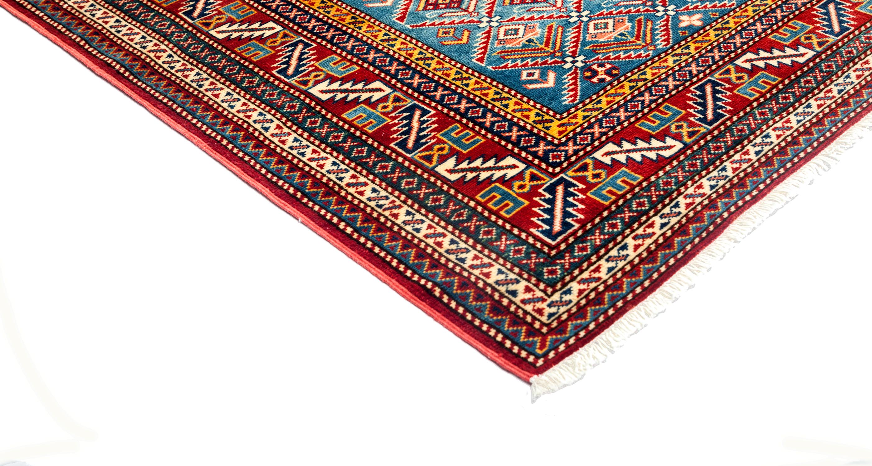 Color: Red - Made In: Pakistan. 100% Wool. With their earthy palettes and geometric patterns, the hand knotted rugs of the Southwestern collection make beautiful additions to rustic and lodge-style rooms. At the same time, they contribute a sense of