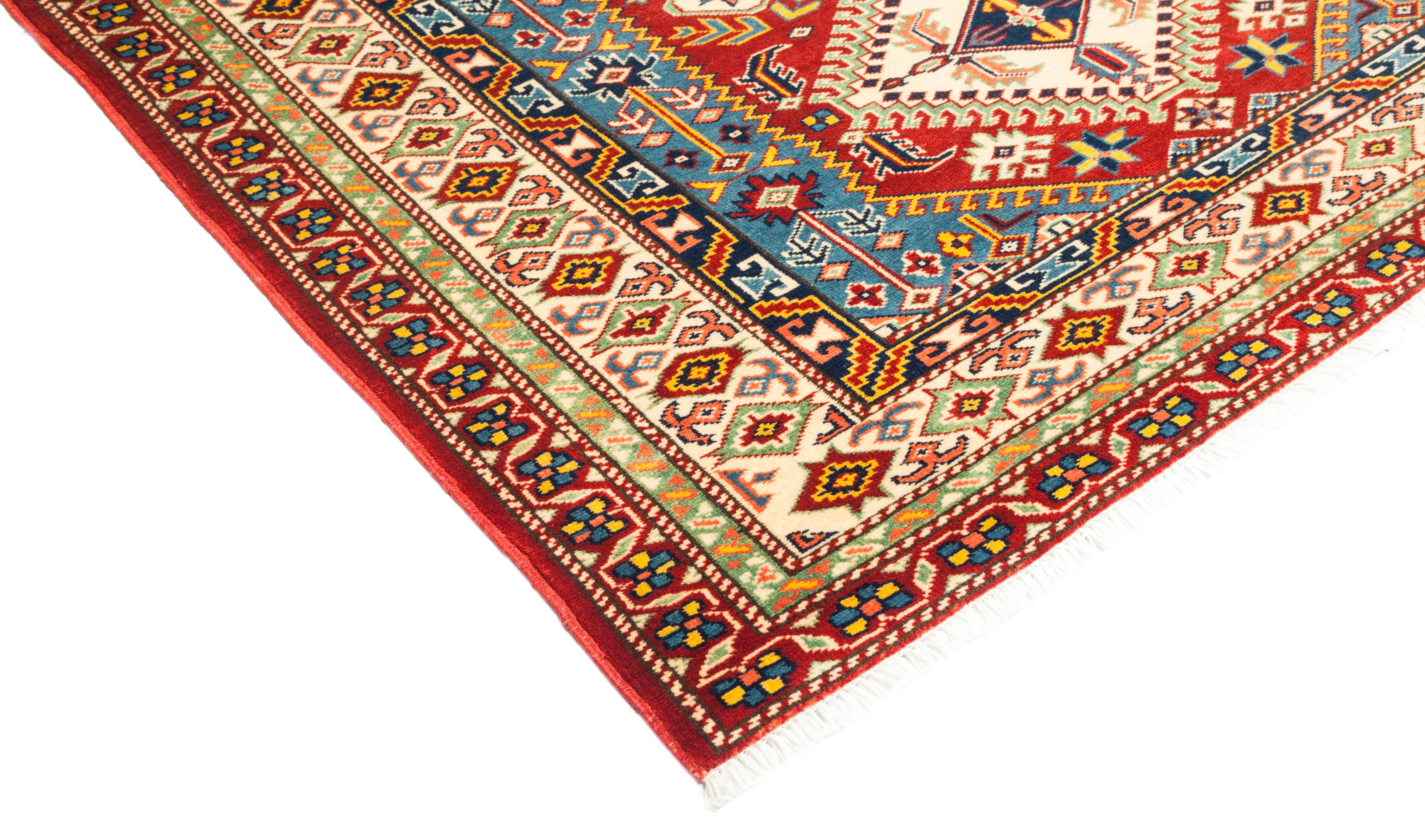 Color: red, made in: Pakistan. 100% wool. With their earthy palettes and geometric patterns, the hand knotted rugs of the Southwestern collection make beautiful additions to rustic and lodge-style rooms. At the same time, they contribute a sense of