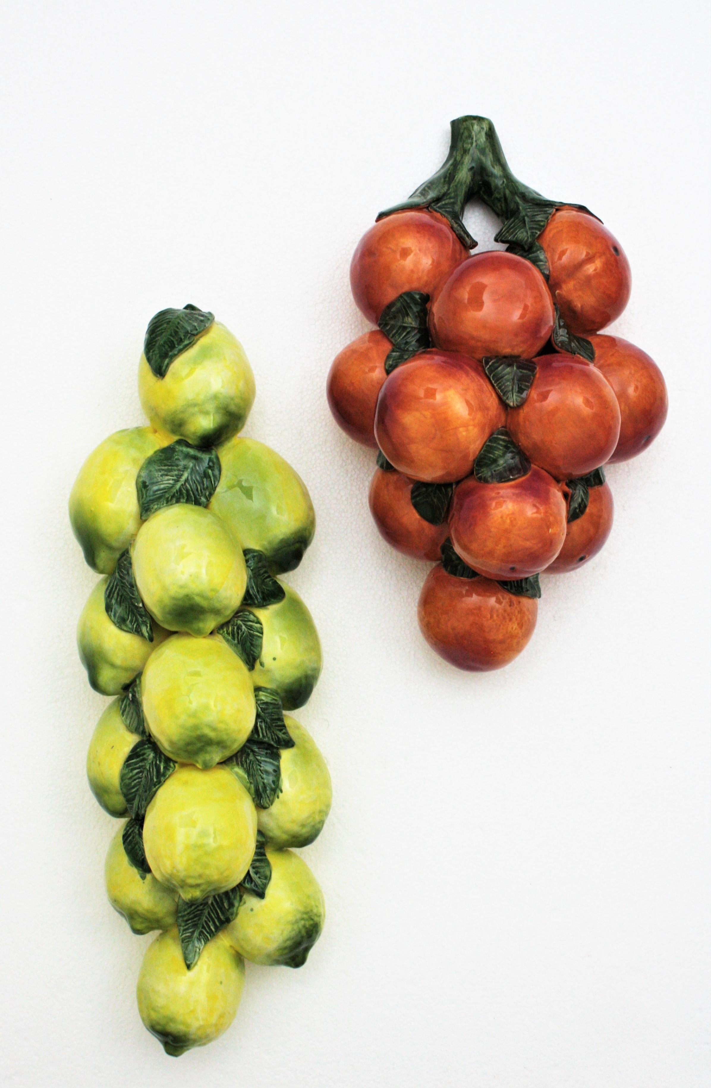 Stunning set of lemons and oranges Manises Majolica ceramic wall decorations, Spain, 1960s.
This colorful pair of wall decorations will add a cool and funny accent wherever you place them. They can be hung in a kitchen's wall or placed in a cabinet