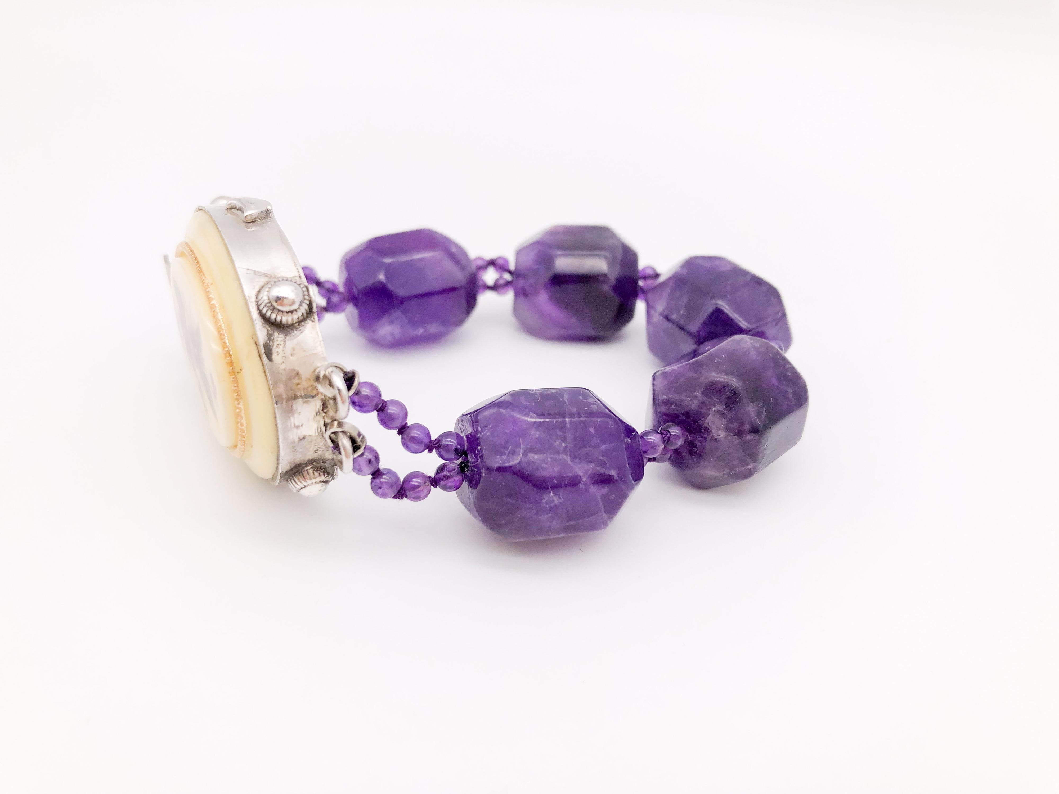 One-of-a-Kind 
Four big bright faceted Amethyst stones set in this one-of-a-kind bracelet .
Sterling Silver box clasp Bakelite( Bakelite made perhaps its largest stamp on the world of fashion. Bakelite jewelry became immensely popular in the 1920s