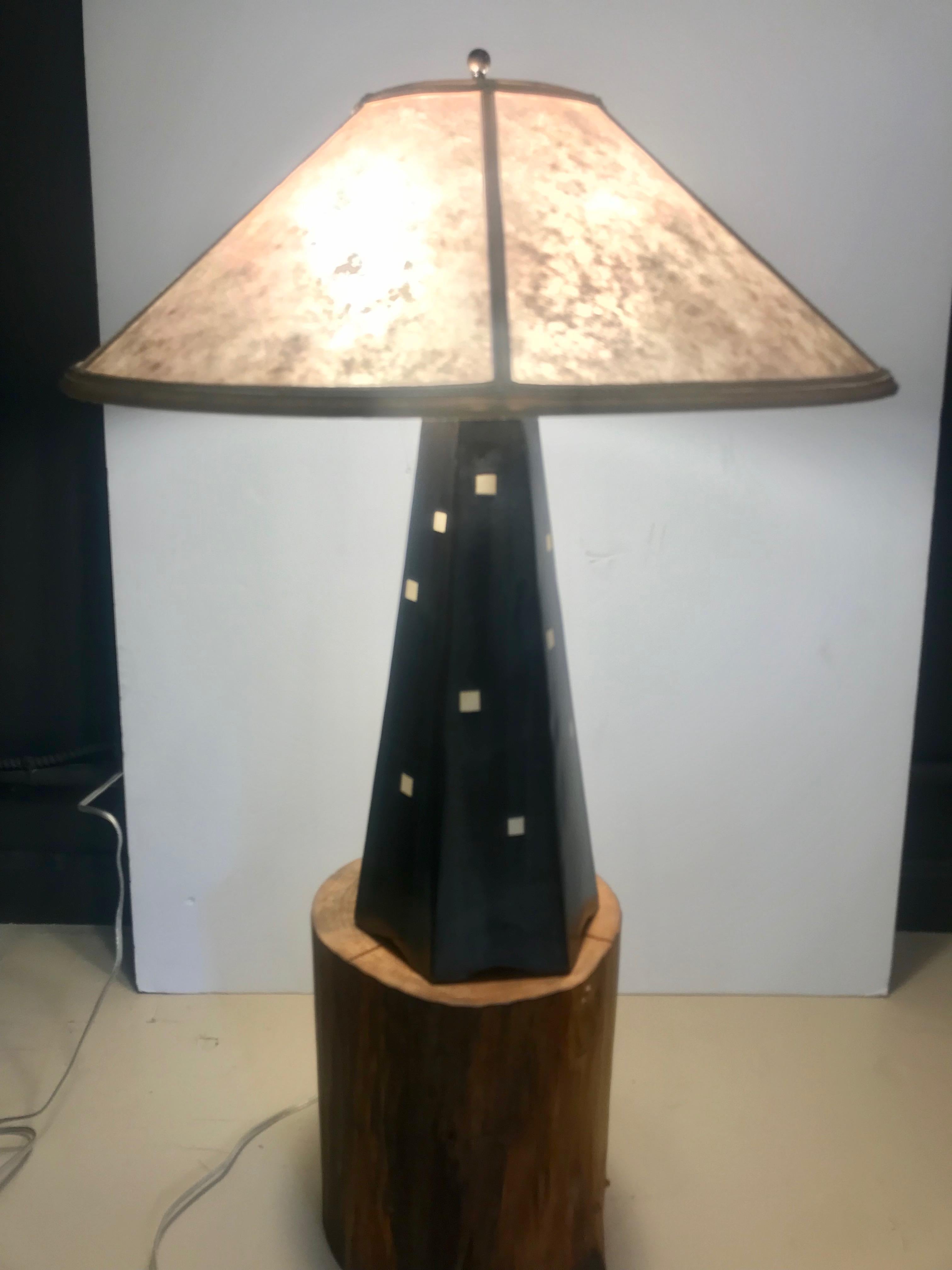 A stunning artisan crafted stoneware lamp having a black column dotted with white geometric squares by renowned artist Jim Webb. It's from his Hopewell collection in onyx glaze with a beautiful silver mica.
Dimensions:
Footprint: 7.25 x